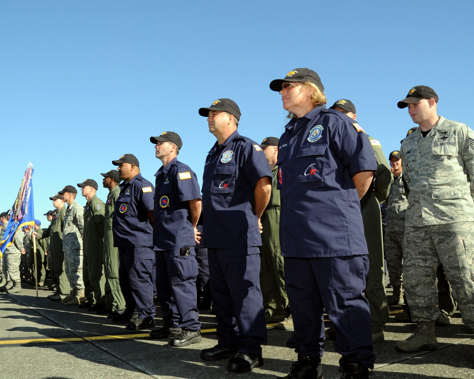 JOINT BASE LEWIS-MCCHORD, Wash. – The 2011 Altus Air Force Base, Okla., Rodeo team stand in formation during the opening ceremony of the 2011 Air Mobility Command Rodeo July 24, 2011. A total of seven teams from the 97th Security Forces Squadron, 97th Maintenance Directorate, 97th Logistics Readiness Squadron, 54th Air Refueling Squadron and 58th Airlift Squadron are competing in multiple events July 24-29 that are designed to get the best from the best. AMC Rodeo is the U.S. Air Force's and Air Mobility Command’s premier international combat skill and flying operations competition designed to develop and improve techniques, procedures and interoperability, while optimizing international mobility partnerships and enhancing mobility operations. (U.S. Air Force photo by Airman 1st Class Kenneth W. Norman / Released / 97th Air Mobility Wing Rodeo Public Affairs)