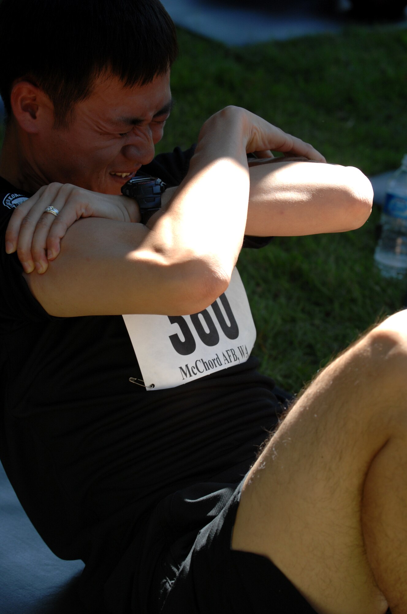 A member of the 167th Air Wing, Pusan, Republic of Korea air force team performs sit-ups at the "Fit to Fight" competition, July 24, 2011, at Joint Base Lewis-McChord, Wash. The competition for Air Mobility Rodeo 2011 evaluates U.S. and international Airmen on their fitness abilities. The eve ntconsists of three elements: push-ups, sit-ups, and a mile-and-a-half run.Rodeo is the U.S. Air Force's and Air Mobility Command's premier international combat skills and flying operations competition designed to develop and improve techniques procedures, interoperability, while optimizing international mobility partnerships and enhancing mobility operations. (U.S. Air Force Photo/Senior Airman Brianna Veesart)