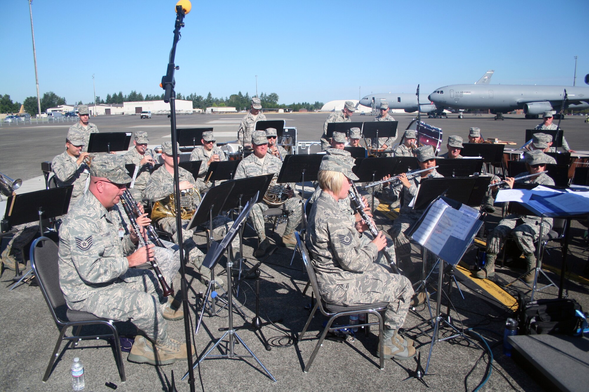Members of the Band of the Golden West of Travis Air Force Base, Calif., play music at the beginning of opening ceremonies for Air Mobility Rodeo 2011 on July 24, 2011, at Joint Base Lewis-McChord, Wash. Air Mobility Rodeo 2011, sponsored by the Air Mobility Command, is the Mobility Air Force's readiness competition. This competition focuses on improving worldwide air mobility forces' professional core abilities. More than 150 teams and 3,000 people from the Air Force, and Air Force Reserve, as well as allied nations are participating in Rodeo. (U.S. Air Force Photo/Master Sgt. Scott T. Sturkol)