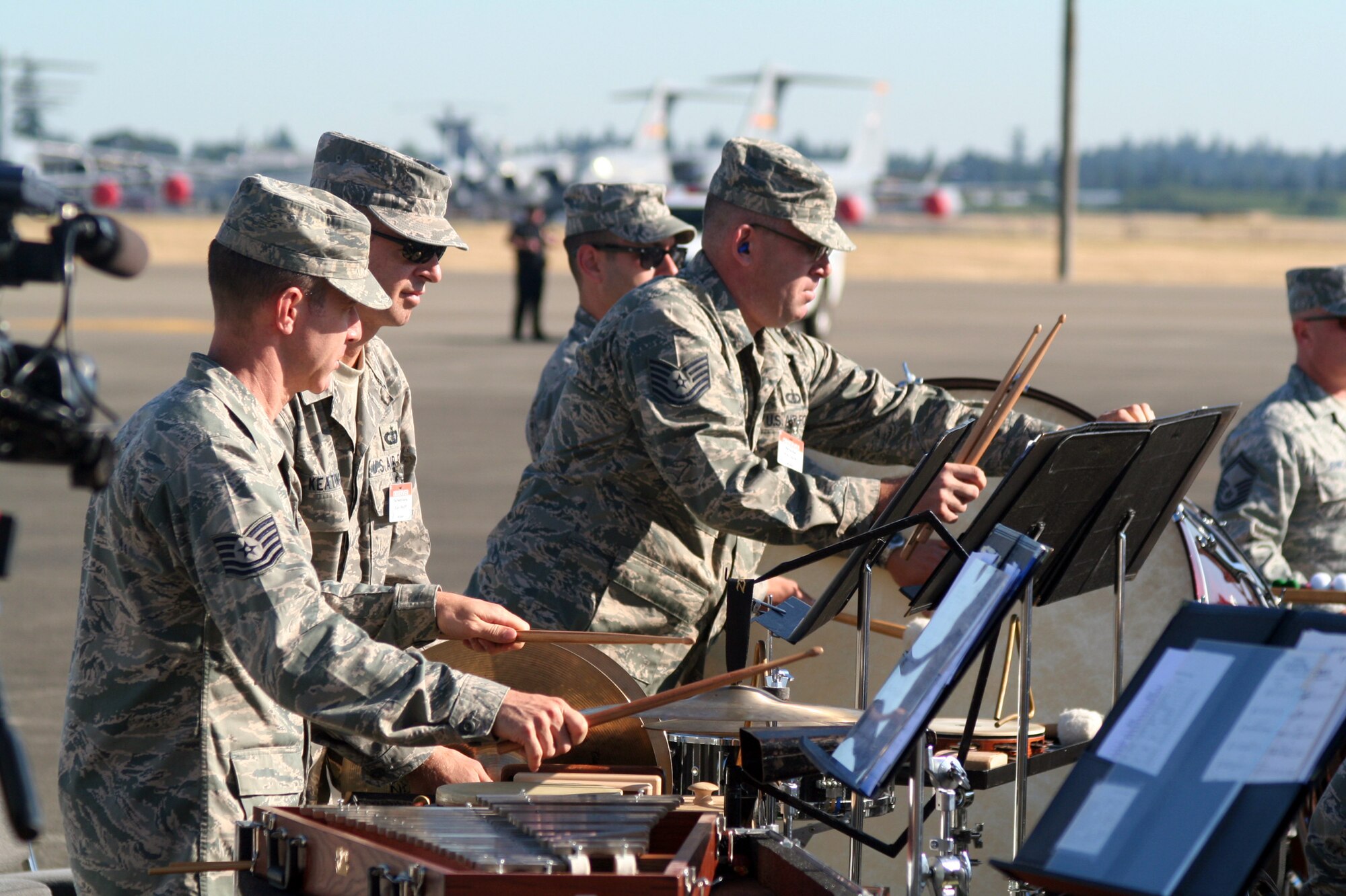 Members of the Band of the Golden West of Travis Air Force Base, Calif., play music at the beginning of opening ceremonies for Air Mobility Rodeo 2011 on July 24, 2011, at Joint Base Lewis-McChord, Wash. Air Mobility Rodeo 2011, sponsored by the Air Mobility Command, is the Mobility Air Force's readiness competition. This competition focuses on improving worldwide air mobility forces' professional core abilities. More than 150 teams and 3,000 people from the Air Force, and Air Force Reserve, as well as allied nations are participating in Rodeo. (U.S. Air Force Photo/Master Sgt. Scott T. Sturkol)