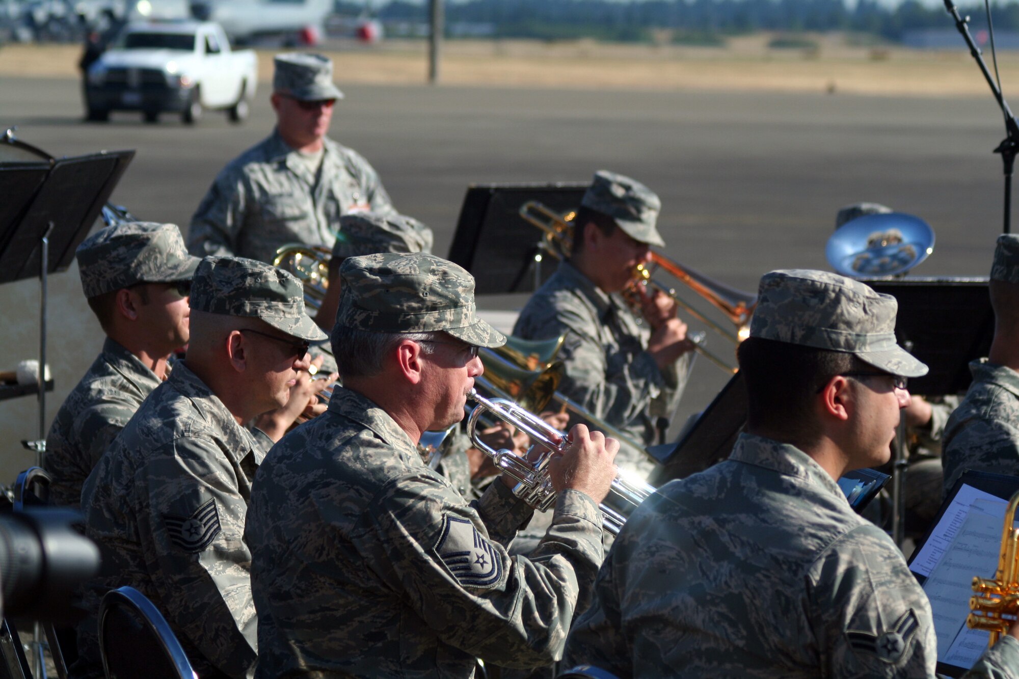 Members of the Band of the Golden West of Travis Air Force Base, Calif., play music at the beginning of opening ceremonies for Air Mobility Rodeo 2011 on July 24, 2011, at Joint Base Lewis-McChord, Wash. Air Mobility Rodeo 2011, sponsored by the Air Mobility Command, is the Mobility Air Force's readiness competition. This competition focuses on improving worldwide air mobility forces' professional core abilities. More than 150 teams and 3,000 people from the Air Force, and Air Force Reserve, as well as allied nations are participating in Rodeo. (U.S. Air Force Photo/Master Sgt. Scott T. Sturkol)