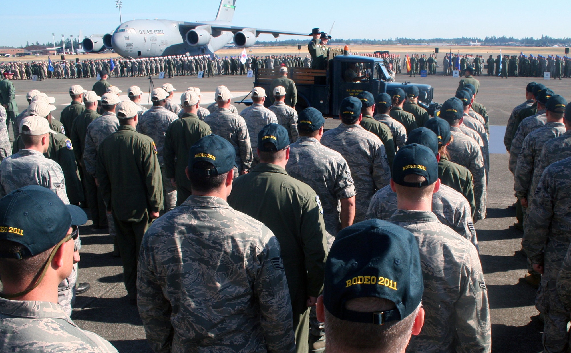 Gen. Raymond E. Johns Jr., Air Mobility Command commander, and Brig. Gen. Rick Martin, Rodeo commander, participate in a pass and review during opening ceremonies for Air Mobility Rodeo 2011 at Joint Base Lewis-McChord, Wash., on July 24, 2011. (U.S. Air Force Photo/Master Sgt. Scott T. Sturkol)