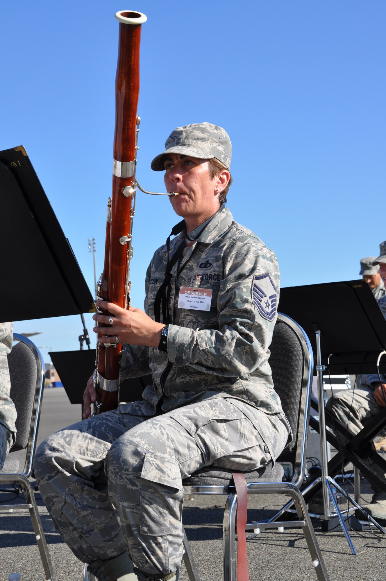 Master Sgt. Wendy Harvey, U. S. Air Force Band of the Golden West clarinet player, performs the "National Anthem" July 24, 2011 at the open ceremonies for the Air Mobility Rodeo at Joint Base Lewis-McChord, Wash. Air Mobility Rodeo 2011 is a biennial international competition that focuses on mission readiness, air drops, air refueling and other events that showcase the skills of mobility crews from across the globe. (U.S. Air Force photo/ Airman 1st Class Michael Battles)