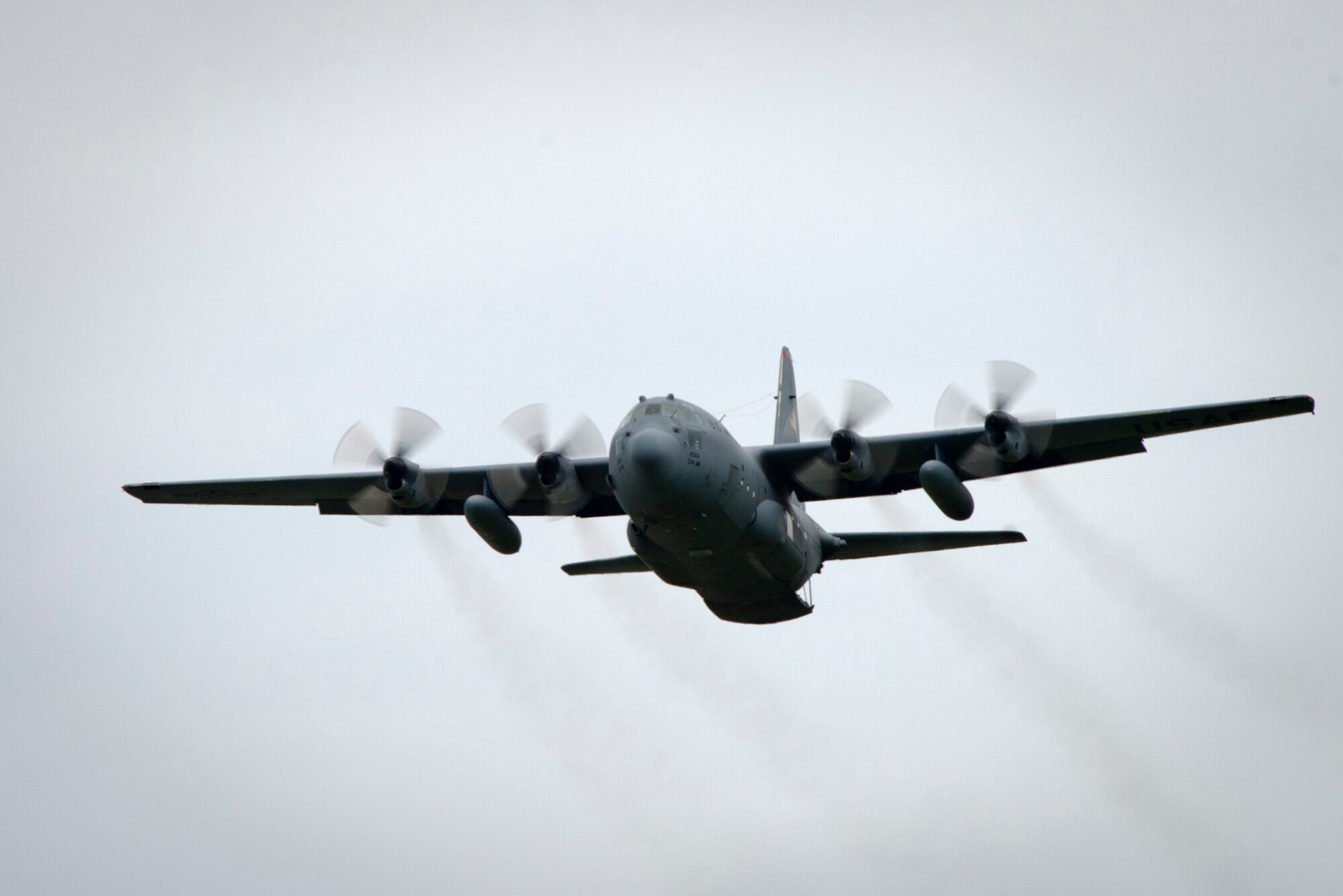YOKOTA AIR BASE, Japan -- A 36th Airlift Squadron C-130 Hercules flies over Yokota Air Base, Japan, during a practice airdrop July 22, 2011. Lt. Gen. Burton Field, U.S. Forces, Japan, and 5th Air Force commander, flew on the aircraft to learn more about the C-130 mission. (U.S. Air Force photo/Staff Sgt. Samuel Morse)