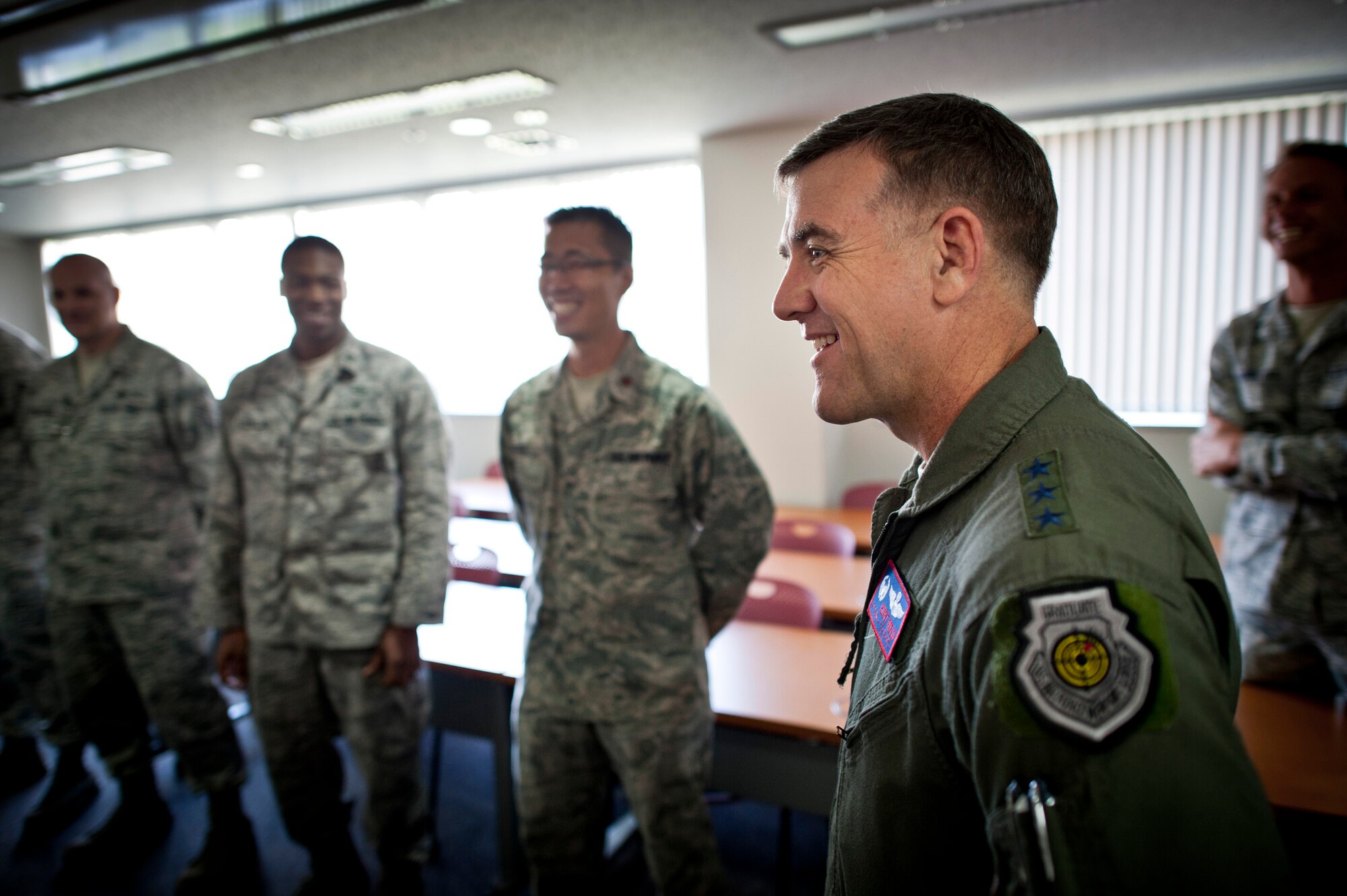 YOKOTA AIR BASE, Japan -- Lt. Gen. Burton Field, U.S. Forces, Japan, and 5th Air Force commander, visits with Airmen from the 374th Civil Engineer Squadron and 374th Aerospace Medicine Squadron at Yokota Air Base, Japan, July 22, 2011.  (U.S. Air Force photo/Staff Sgt. Samuel Morse)