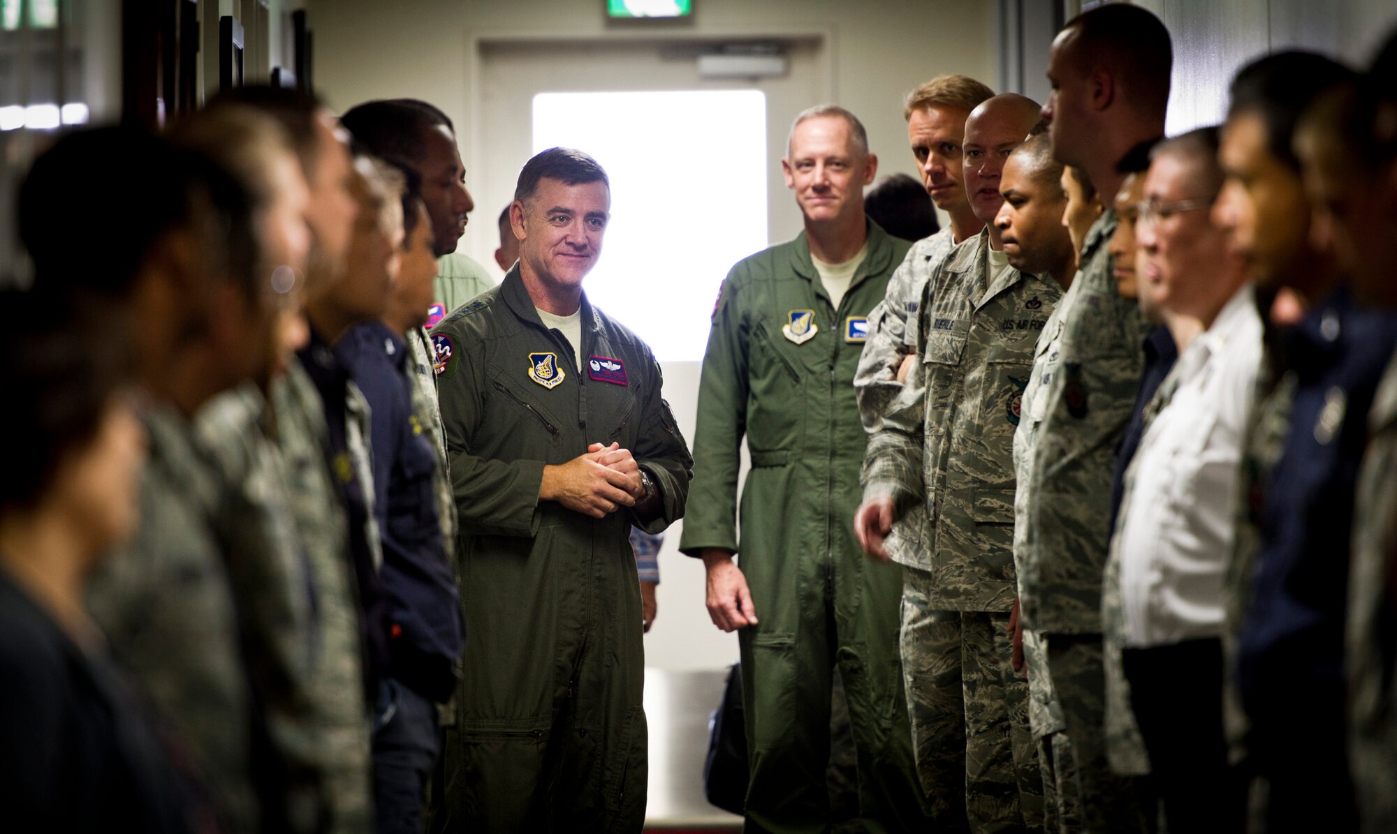 YOKOTA AIR BASE, Japan -- Lt. Gen. Burton Field (center left), U.S. Forces, Japan, and 5th Air Force commander, and Col. Otto Feather, 374th Airlift Wing commander, visit with Airmen from the 374th Civil Engineer Squadron fire department at Yokota Air Base, Japan, July 22, 2011.  (U.S. Air Force photo/Staff Sgt. Samuel Morse)