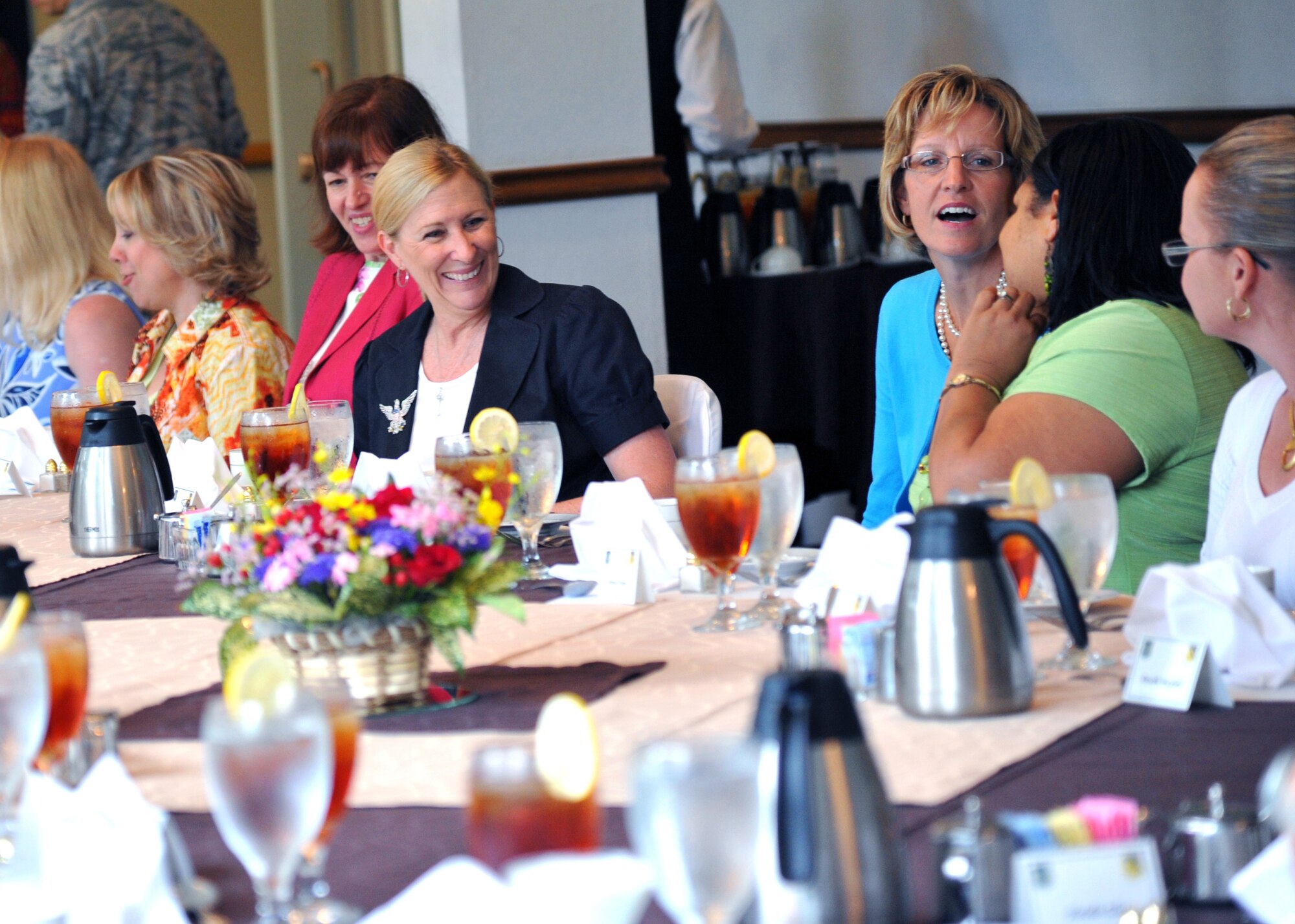 YOKOTA AIR BASE, Japan -- Lisa Field (center left), wife of Lt. Gen. Burton Field, U.S. Forces, Japan, and 5th Air Force commander, talks with key spouses during a luncheon at Yokota Air Base, Japan, July 21, 2011. General Field and Mrs. Field visited various locations throughout the 374th Airlift Wing. (U.S. Air Force photo/Airman 1st Class Krystal M. Garrett) 