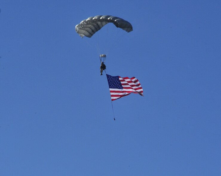 An Airman from the 22nd Special Tactics Squadron parachutes from a C-17
Globemaster III and carries an American flag as part of the opening ceremony
for Air Mobility Command's 2011 Rodeo July 24 at Joint Base Lewis-McChord,
Wash. Rodeo is the Air Force's and AMC's premier international
combat skills and flying operations competition designed to develop and
improve techniques, procedures, and interoperability, while optimizing
international mobility partnerships and enhancing mobility operations. (U.S.
Air Force Photo/Staff Sgt. Frances Kriss)