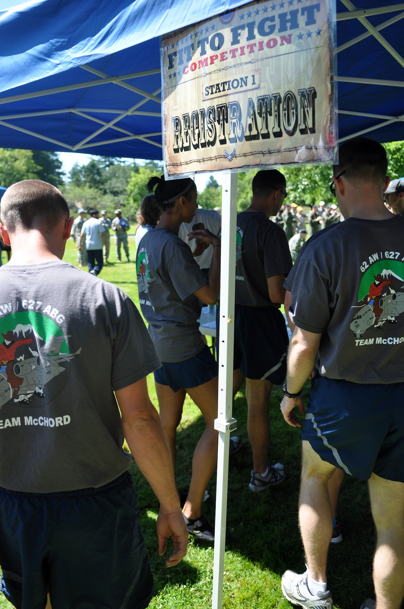 Airmen representing the 62nd Airlift Wing and 627th Air Base Group Rodeo combination team register for the ‘Fit to Fight’ challenge July 24, 2011, at Joint Base Lewis-McChord, Wash. The challenge consisted of a 1.5 mile run and one minute of both push-ups and sit-ups. The physical challenge is just one aspect of Air Mobility Rodeo 2011, a biennial international competition that focuses on mission readiness, featuring airdrops, aerial refueling and other events that showcase the skills of mobility crews from around the world. (U.S. Air Force photo/Airman 1st Class Leah Young)