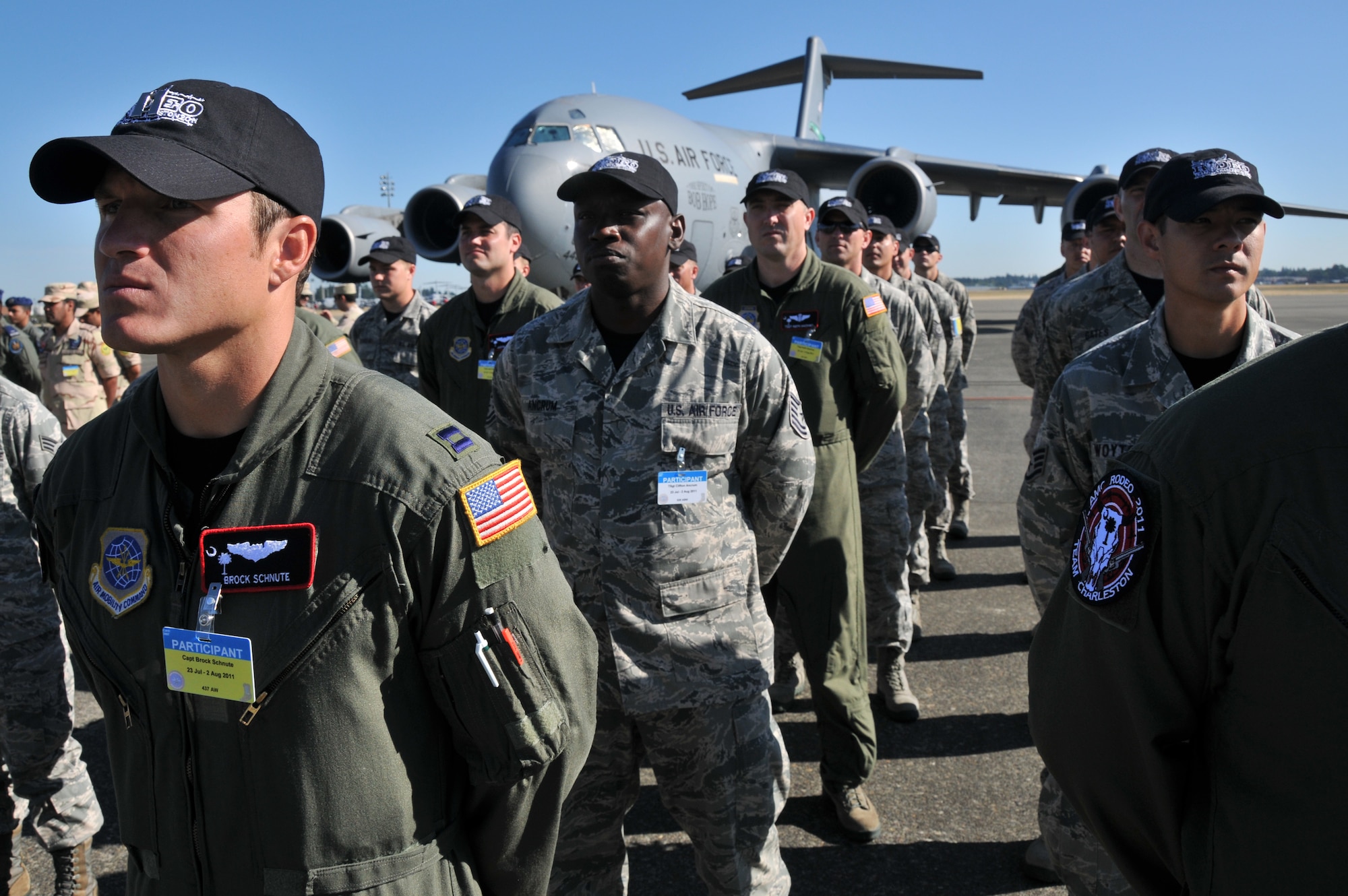 Airmen from Joint Base Charleston, S.C., stand at ease during the Air Mobility Rodeo 2011 opening ceremony, July 24, 2011, at Joint Base Lewis-McChord, Wash. Air Mobility Rodeo 2011 is a biennial international competition that focuses on mission readiness, featuring airdrops, aerial refueling and other events that showcase the skills of mobility crews from around the world. 
 (U.S. Air Force photo/ Airman 1st Class Jared Trimarchi) 
