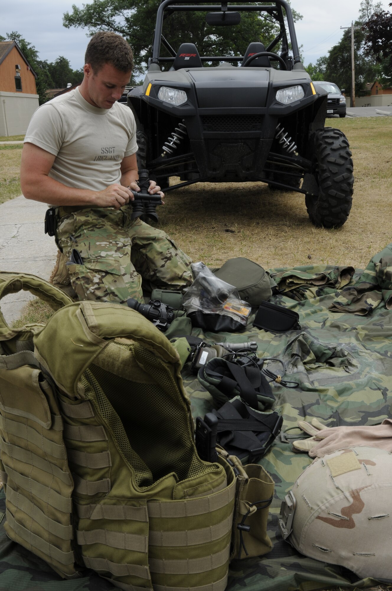Staff Sgt. Sean Ireland from Selfridge Air National Guard Base, 107th Weather Flight Special Operations weather team group, prepares his military-issued tactical equipment for inspection during the annual Gray Wolverine training exercise held at Combat Readiness Training Center Alpena Michigan, July 24, 2011. Ireland’s tactical equipment is designed to give him an advantage over enemies in hostile environments.  (U.S. Air Force photo by TSgt David Kujawa)