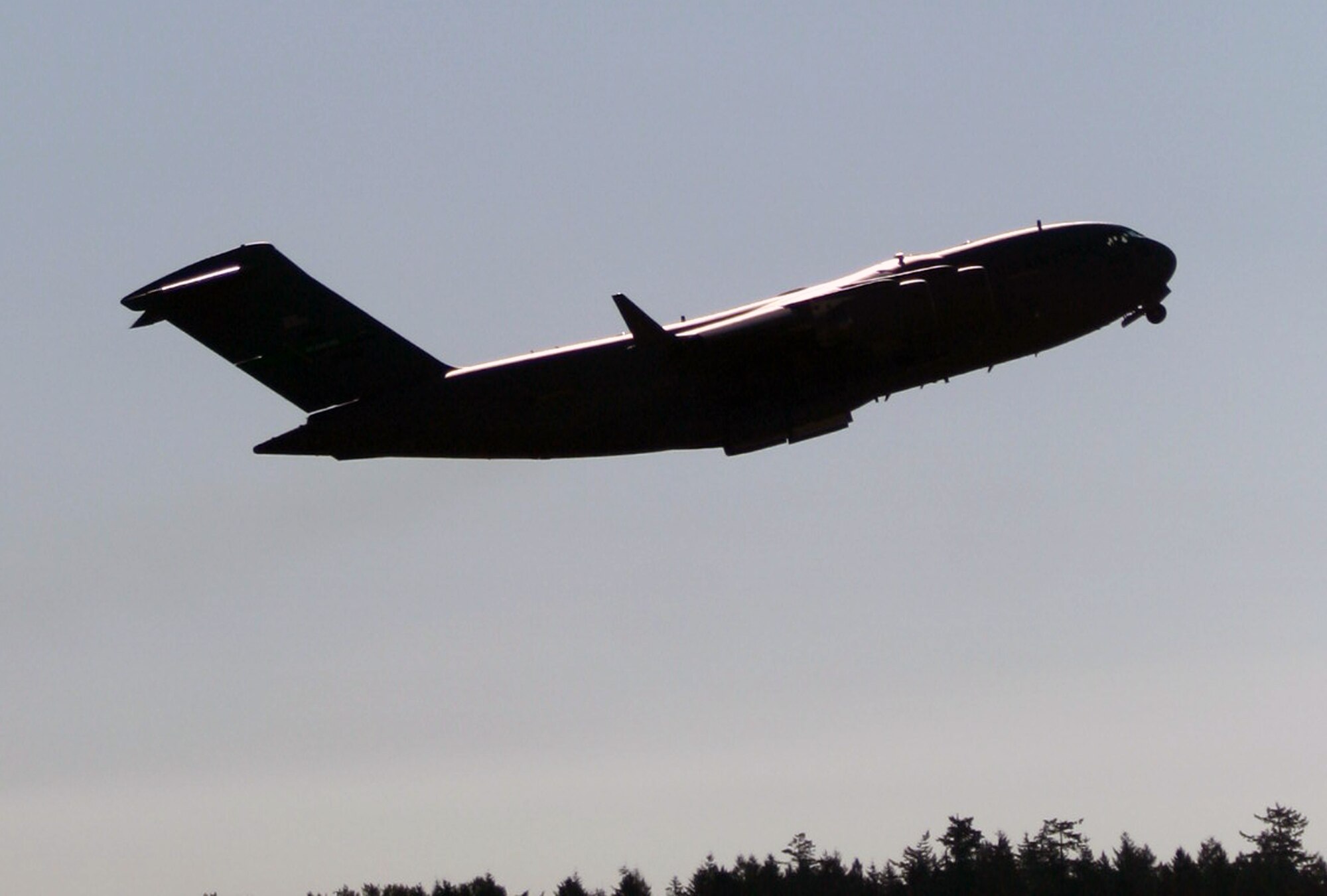 A C-17 Globemaster III from the 62nd Airlift Wing leaves for a mission from Joint Base Lewis-McChord, Wash., in preparation for Air Mobility Rodeo 2011 on July 23, 2011. Air Mobility Rodeo 2011, sponsored by the Air Mobility Command, is the Mobility Air Force's readiness competition. This competition focuses on improving our worldwide air mobility forces' professional core abilities. (U.S. Air Force Photo/Master Sgt. Scott T. Sturkol)