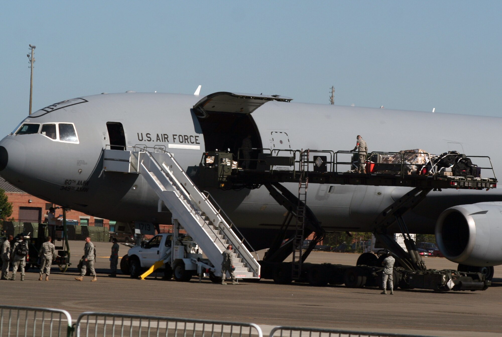 A KC-10 Extender from the 60th Air Mobility Wing at Travis Air Force Base, Calif., is being unloaded at Joint Base Lewis-McChord, Wash., as part of team arrivals for Air Mobility Rodeo 2011 on July 23, 2011. Air Mobility Rodeo 2011, sponsored by the Air Mobility Command, is the Mobility Air Force's readiness competition. This competition focuses on improving worldwide air mobility forces' professional core abilities. (U.S. Air Force Photo/Master Sgt. Scott T. Sturkol)