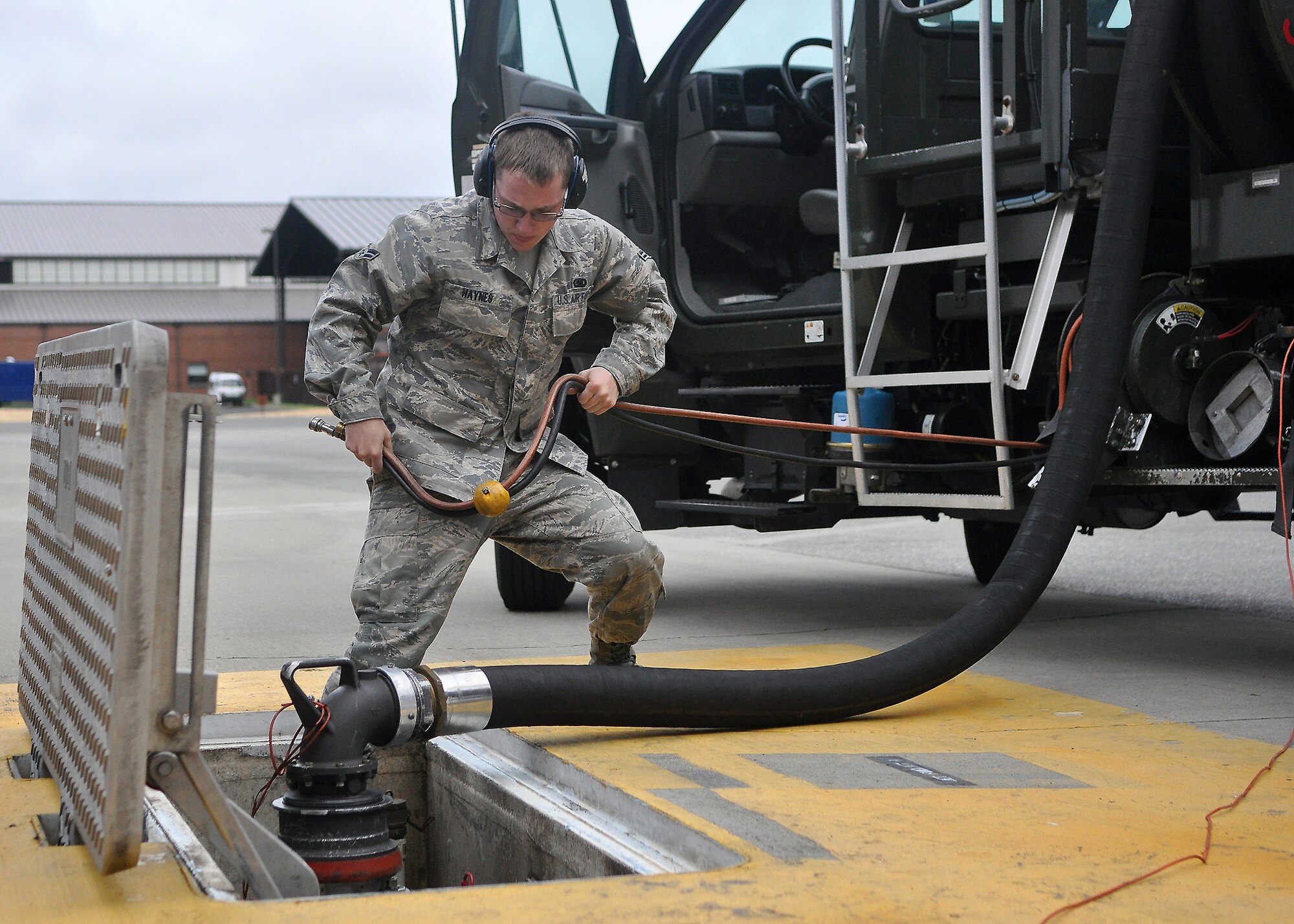 Airman 1st Class Joseph Haynes, 62nd Aircraft Maintenance Squadron Rodeo team member, prepares to fuel a C-17 Globemaster III while participating in a Rodeo training exercise July 21 at Joint Base Lewis-McChord, Wash. Air Mobility Rodeo 2011, sponsored by the Air Mobility Command, is the Mobility Air Force's premier readiness competition. This competition focuses on improving our worldwide air mobility forces' professional core abilities. (U.S. Air Force photo/Airman 1st Class Leah Young)