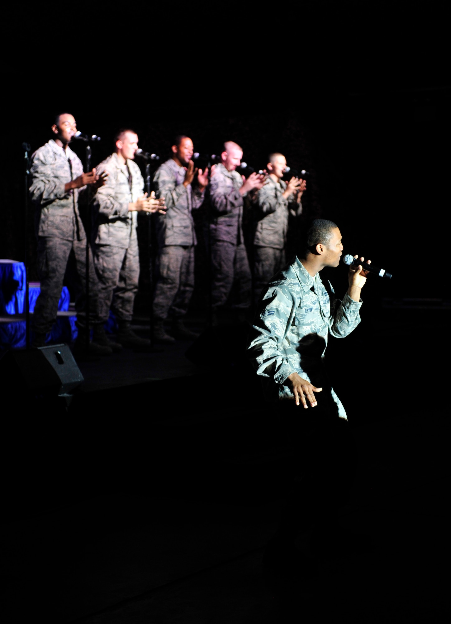 Tops In Blue performs for the men and women of the 380th Air Expeditionary Wing as part of their World Tour 2011--the Tops in Blue Rhythm Nation Tour. The group serves as an expeditionary entertainment unit providing quality entertainment from within Air Force resources for the Air Force family, with priority to Air Force personnel stationed worldwide at remote and  deployed locations while simultaneously promoting community relations, supporting recruiting efforts and serving as ambassadors for the United States of America and the United States Air Force. (U.S. Air Force photo/Staff Sgt. Patrick Mitchell)
