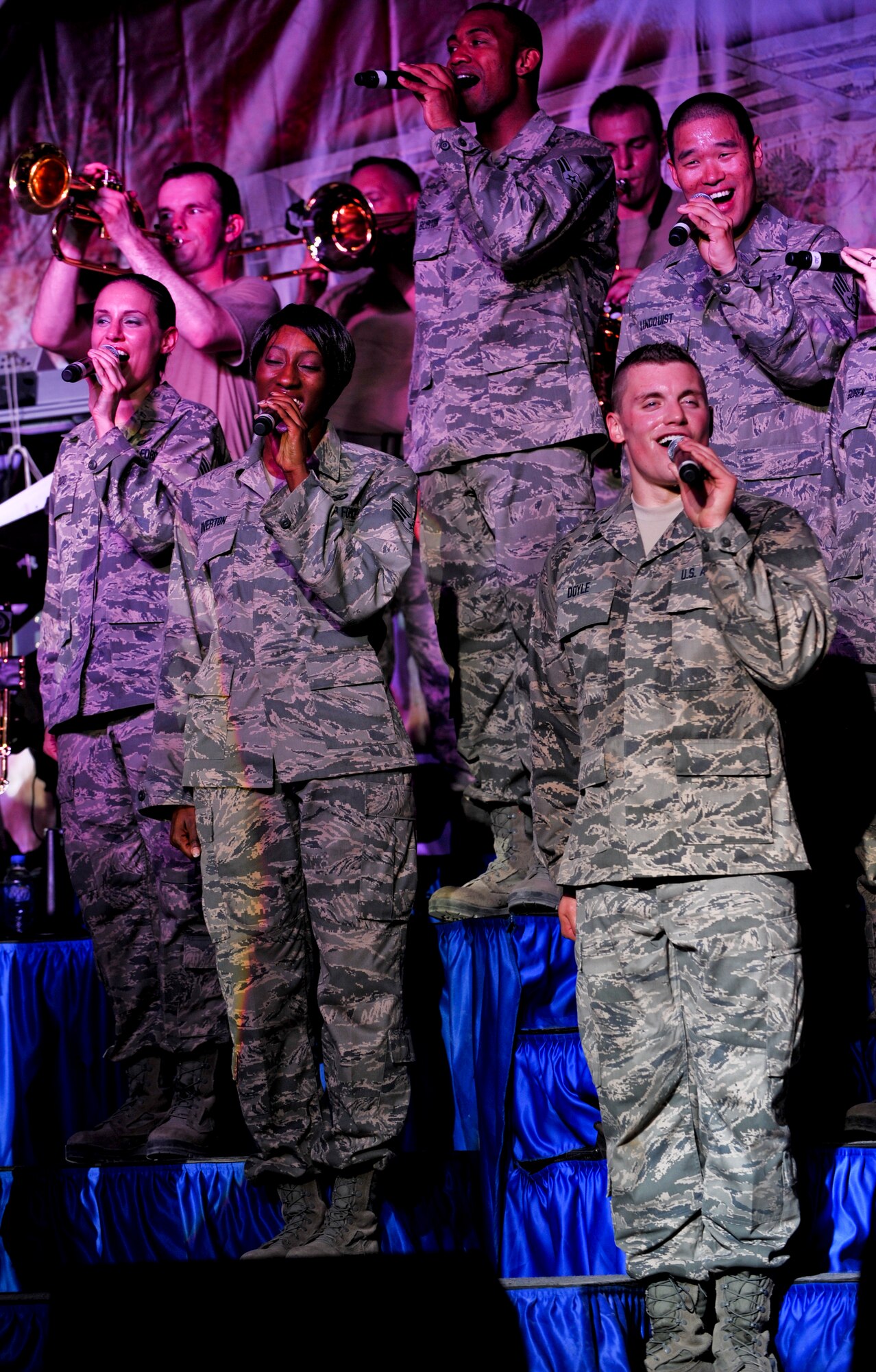 Members of the U.S. Air Force Tops in Blue traveling performance team entertain service members of the 379th Air Expeditionary Wing along with its coalition partners, July 22. On Feb. 6,Tops in Blue sang with Lea Michele from the hit television show “Glee” at Super Bowl XLV. (U.S. Air Force photo/Senior Airman Paul Labbe)