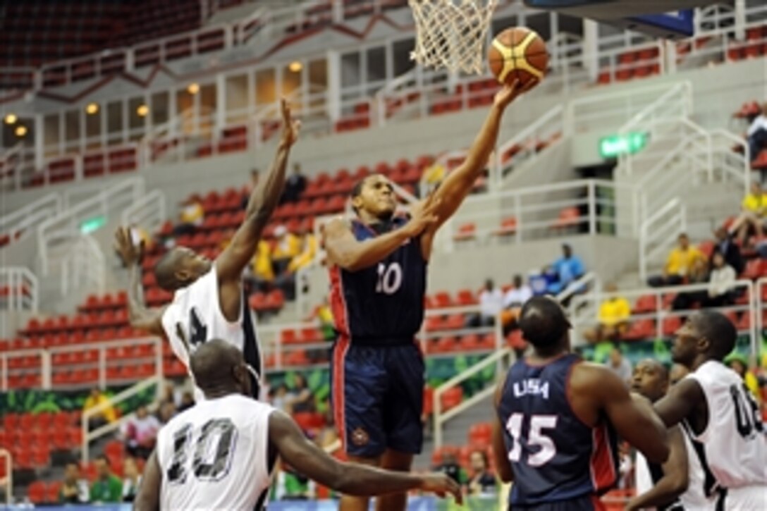 U.S. Army 2nd Lt. Cleveland Richard of Fort Lee, Va., drives for two of his 10 points during Team USA's 74-54 victory over Trinidad and Tobago at the 5th CISM Military World Games in Rio de Janeiro, July 23, 2011. 
