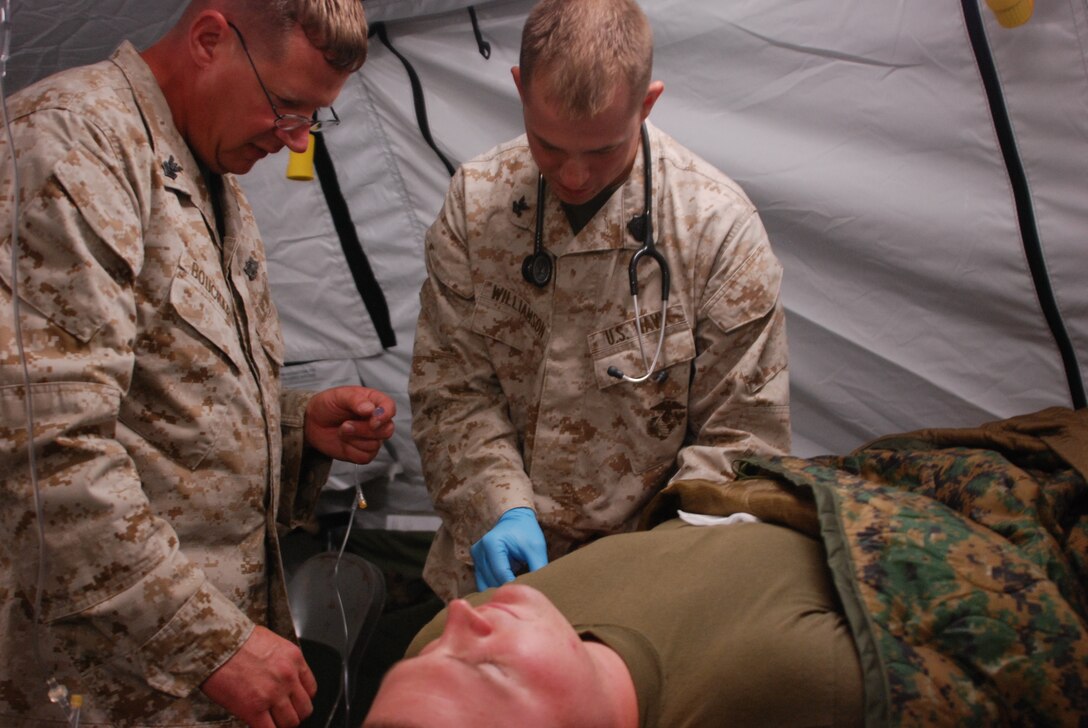 Petty Officer 2nd Class James C. Williamson, a 27-year-old Corpsman with Detachment B, Marine Wing Support Squadron 471, Marine Wing Support Group 47, 4th Marine Aircraft Wing, takes part in training to treat a heat casualty at site 50 near Marine Corps Air Station Yuma, Ariz., July 24. Marines and sailors with the unit are taking part in operation Javelin Thrust 2011, the Marine Corps’ largest training exercise in the United States. Williamson, a Gladwin, Mich., native provides medical support and training to Marines with his unit.