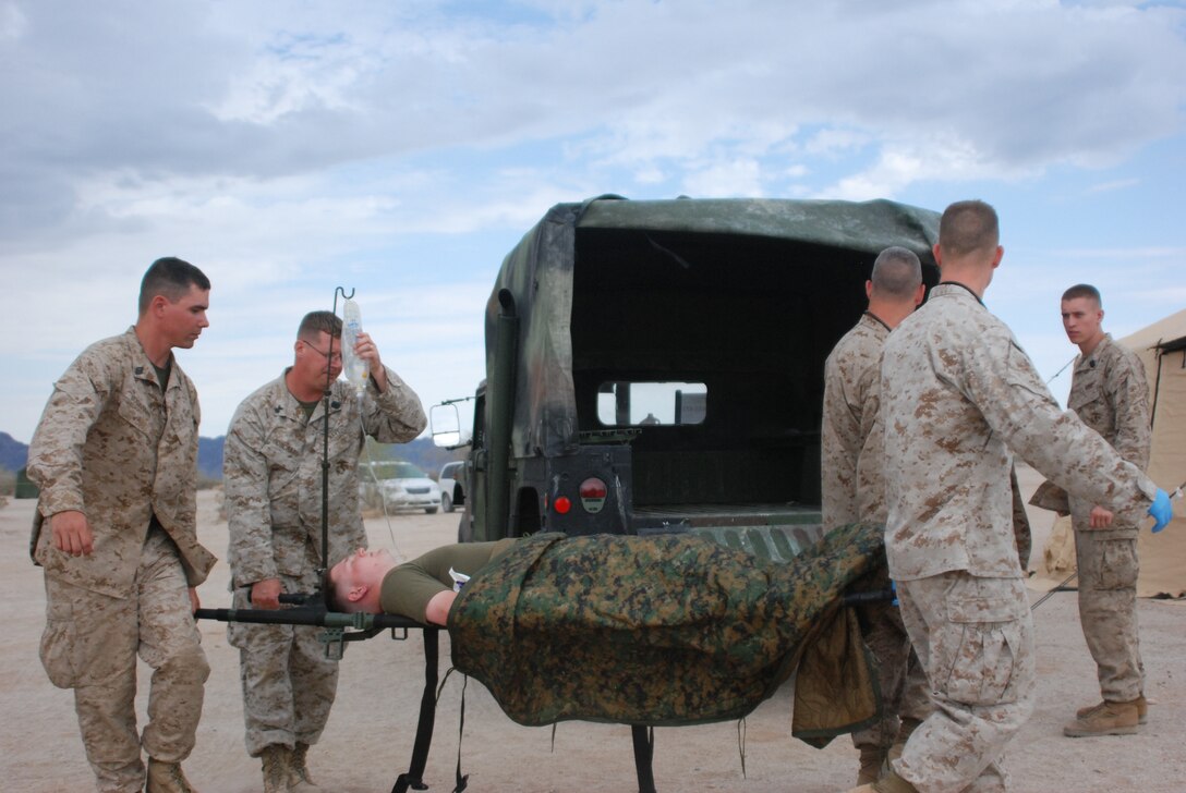 Sailors with Wing Support Squadron 471, Marine Wing Support Group 47, 4th Marine Aircraft Wing, take part in medical training at site 50 near Marine Corps Air Station Yuma, Ariz., July 24. The training was part of exercise Javelin Thrust 2011.