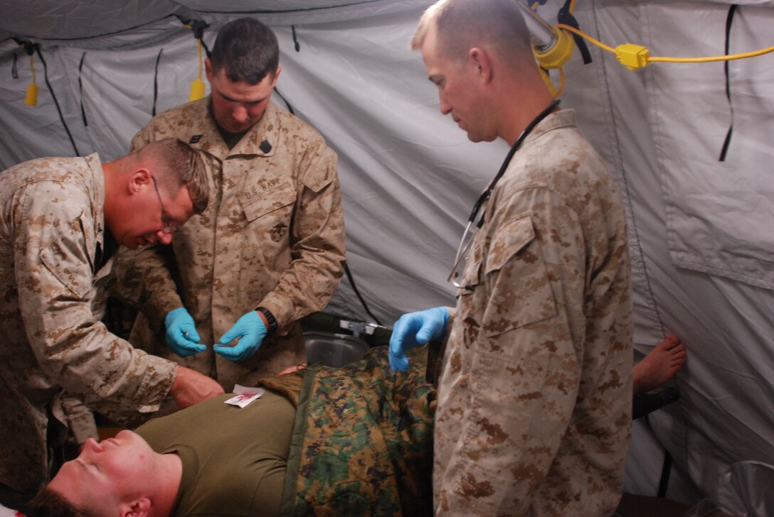 Sailors with Wing Support Squadron 471, Marine Wing Support Group 47, 4th Marine Aircraft Wing, take part in medical training at site 50 near Marine Corps Air Station Yuma, Ariz., July 24. The training was part of exercise Javelin Thrust 2011.