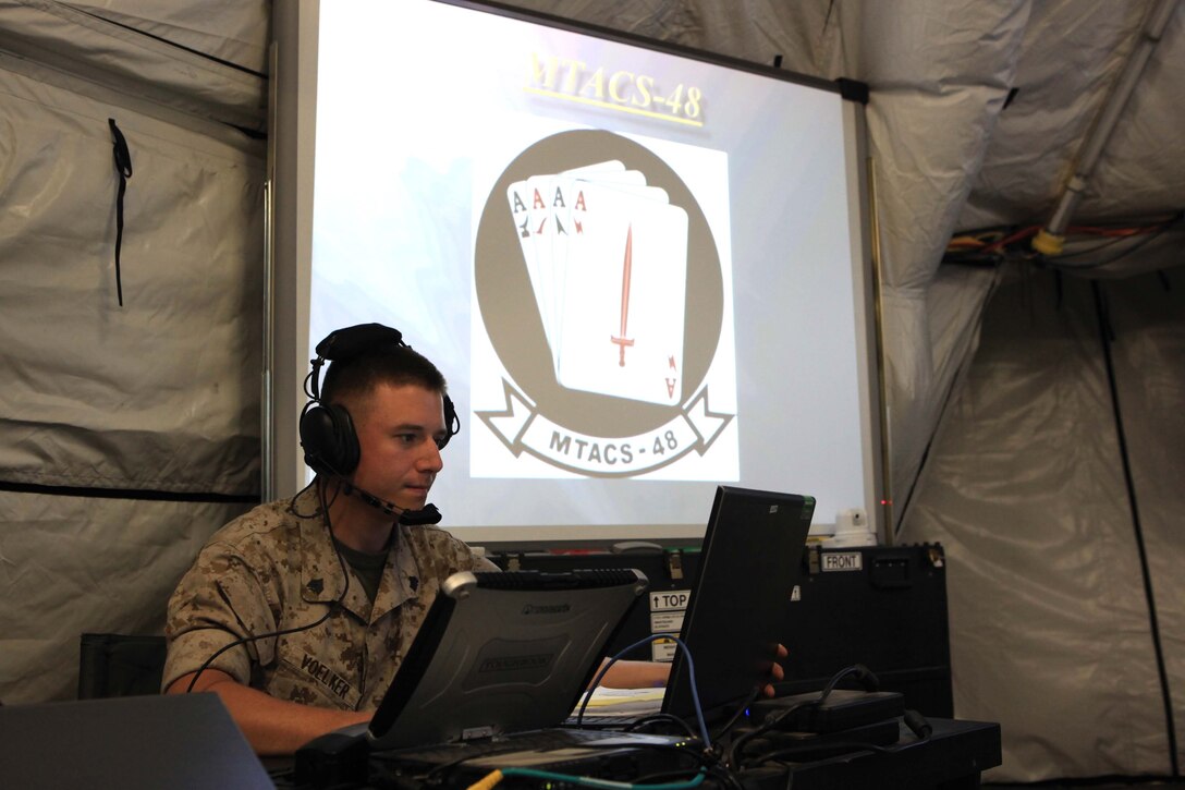Sgt. Robert C. Voelker, Marine Air Control Group 48 air control electronics operator, ensures that all maintenance issues within the tactical air command center are eliminated to facilitate communication during Operation Javelin Thrust at Marine Corps Air Station Yuma, Ariz., July 24. The TACC receives and distributes all communication between forces in an operation environment.