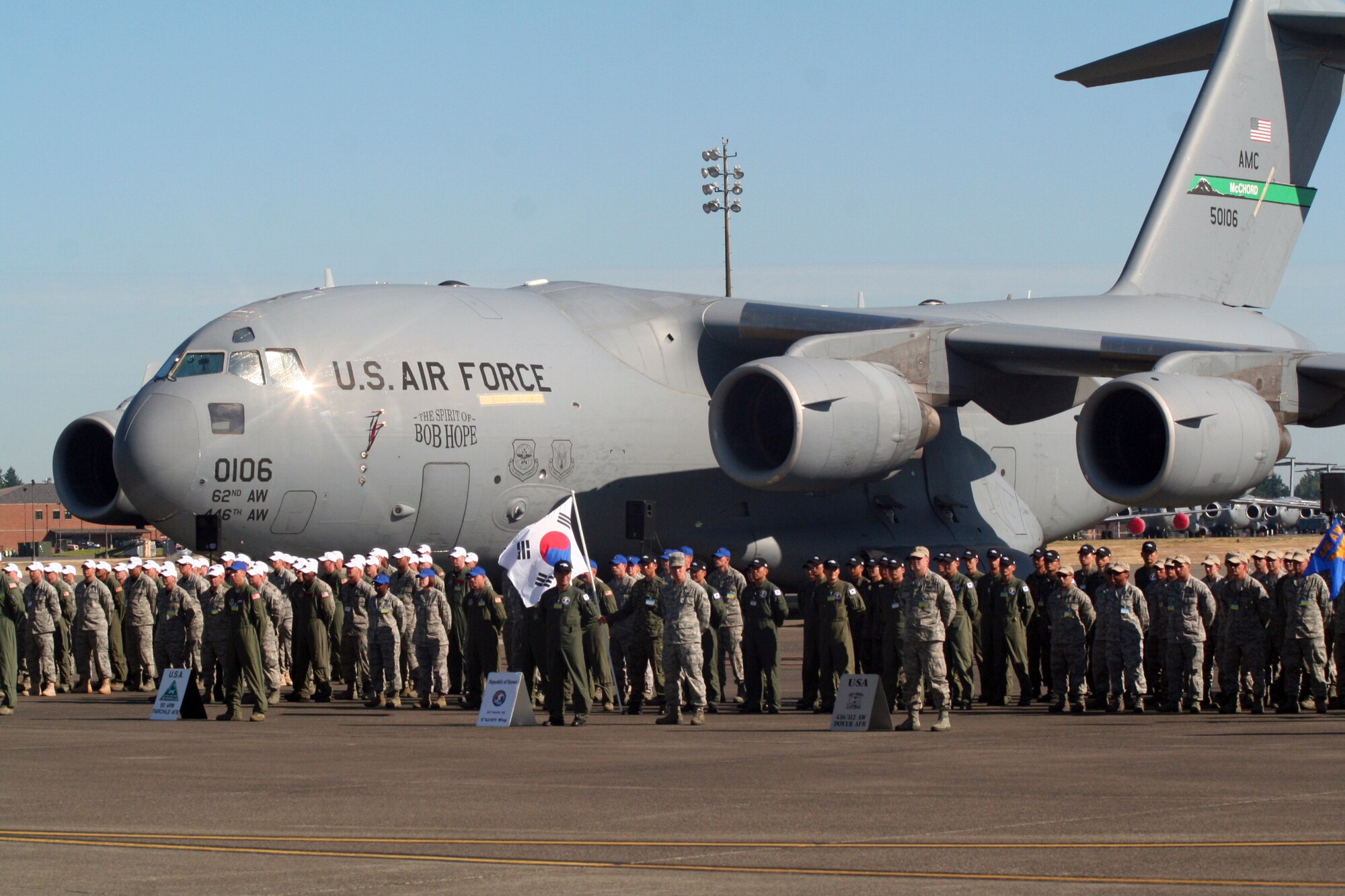 Participants for Air Mobility Rodeo 2011 are shown in formation for opening ceremonies for Rodeo on July 24, 2011, at Joint Base Lewis-McChord, Wash.  Rodeo 2011, sponsored by the Air Mobility Command, is the Mobility Air Force's readiness competition. This competition focuses on improving worldwide air mobility forces' professional core abilities. More than 150 teams and 3,000 people from the Air Force, and Air Force Reserve, as well as allied nations are participating in Rodeo. (U.S. Air Force Photo/Master Sgt. Scott T. Sturkol)