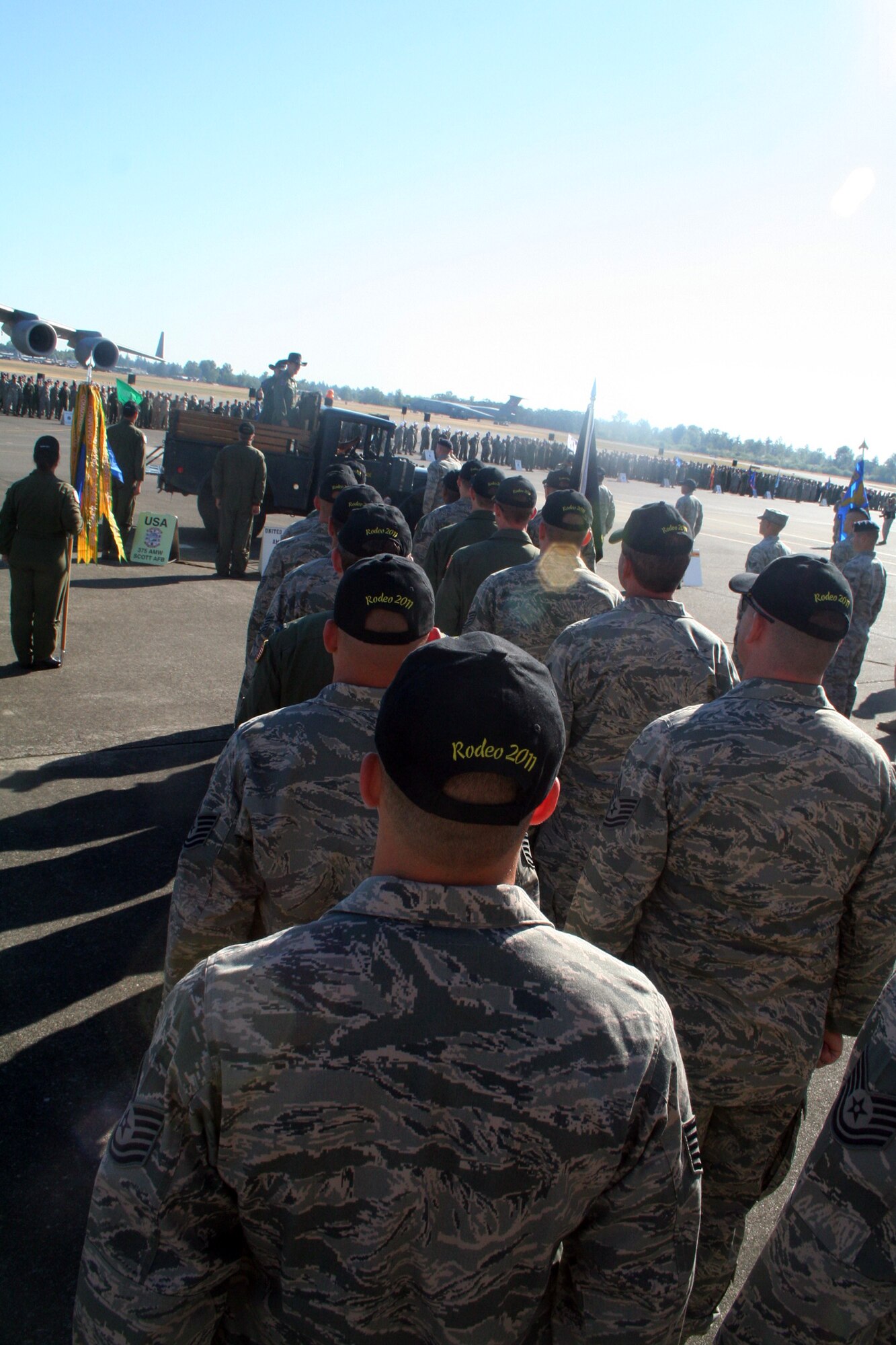 Gen. Raymond E. Johns Jr., Air Mobility Command commander, and Brig. Gen. Rick Martin, Rodeo commander, participate in a pass and review during opening ceremonies for Air Mobility Rodeo 2011 at Joint Base Lewis-McChord, Wash., on July 24, 2011. (U.S. Air Force Photo/Master Sgt. Scott T. Sturkol)