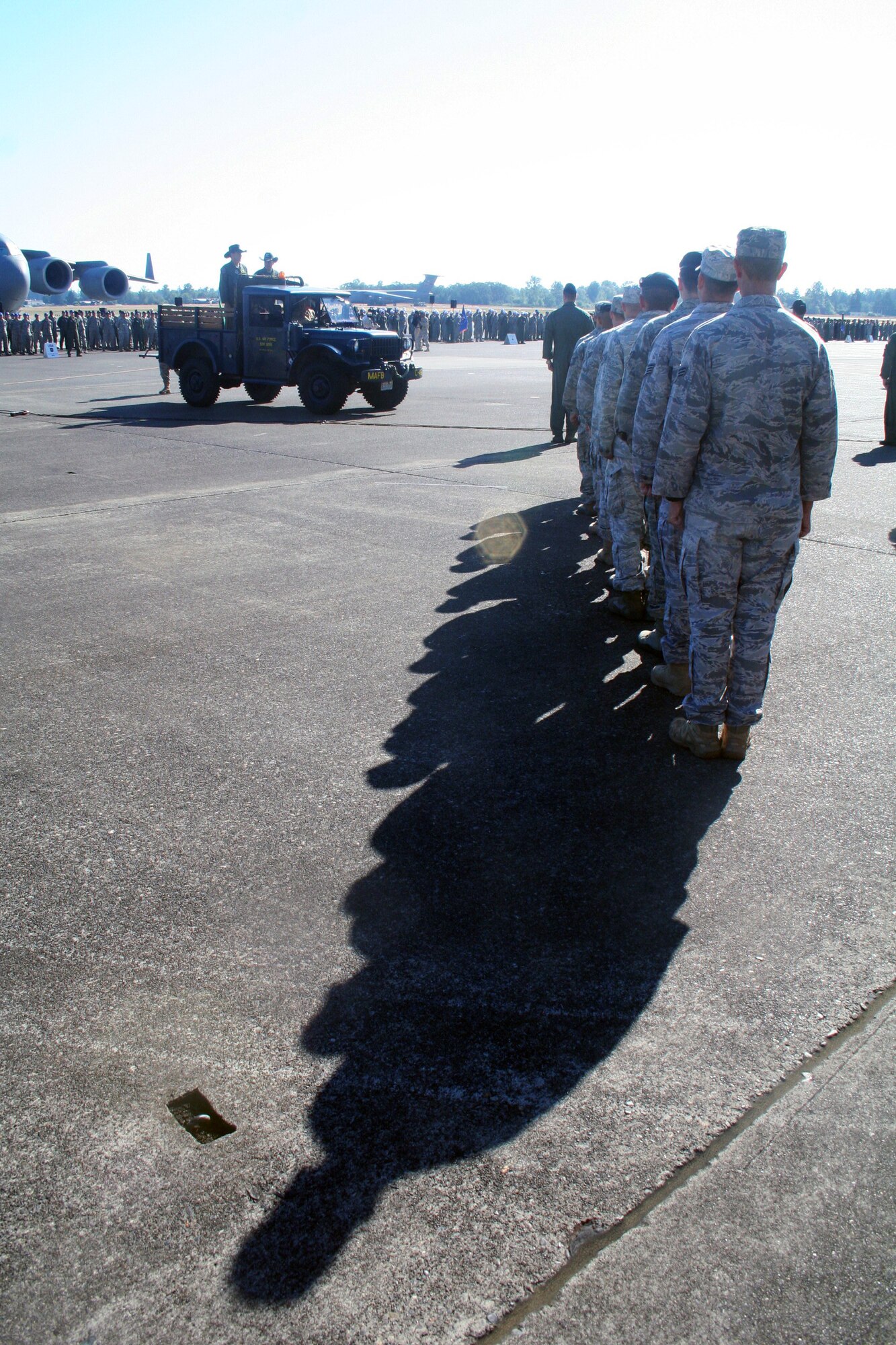 Gen. Raymond E. Johns Jr., Air Mobility Command commander, and Brig. Gen. Rick Martin, Rodeo commander, participate in a pass and review during opening ceremonies for Air Mobility Rodeo 2011 at Joint Base Lewis-McChord, Wash., on July 24, 2011. (U.S. Air Force Photo/Master Sgt. Scott T. Sturkol)