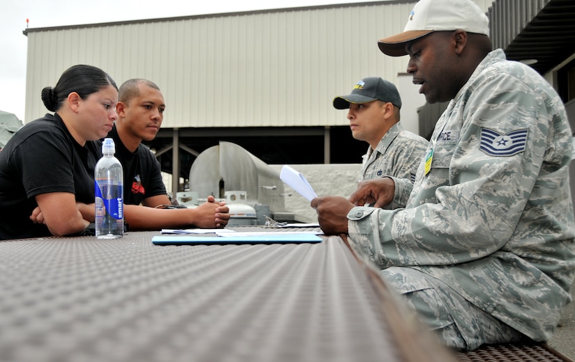 Two sergeants brief two Airmen participating in a forklift driving course, July 25, 2011, at Joint Base Lewis-McChord, Wash. The event was part of Air Mobility Rodeo 2011, a biennial international competition that focuses on mission readiness, featuring airdrops, aerial refueling and other events that showcase the skills of mobility crews from around the world. (U.S. Air Force photo/ Airman 1st Class Jared Trimarchi) 

