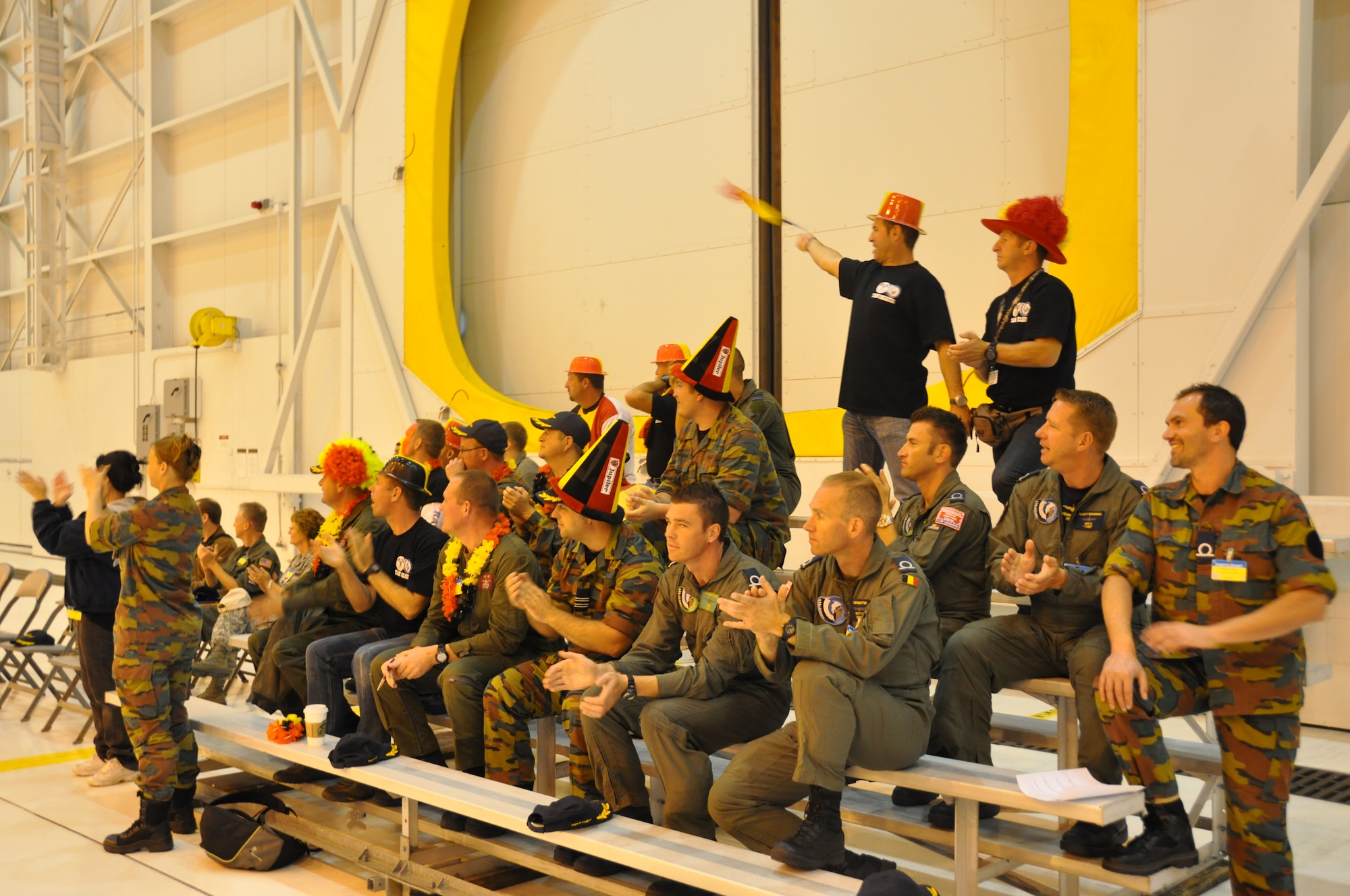 Members from Team Belgium cheer on their members competing in the Maintenance Skill Competition part of the Air Mobility Rodeo 2011 at Joint Base Lewis-McChord, Wash. The MSC tests participants on everyday maintenance tasks that they perform at the home stations. (U.S. Air Force photo/Airman 1st Class Michael Battles) 