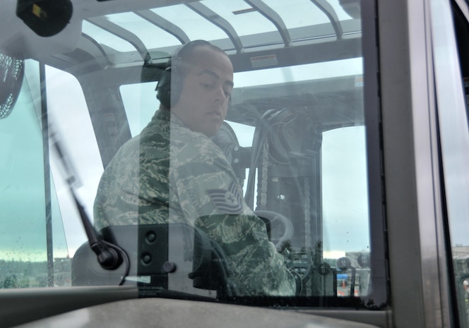 An Airman performs a safety inspection before participating in a forklift driving course, July 25, 2011, at Joint Base Lewis-McChord, Wash. The event was part of Air Mobility Rodeo 2011, a biennial international competition that focuses on mission readiness, featuring airdrops, aerial refueling and other events that showcase the skills of mobility crews from around the world. (U.S. Air Force photo/ Airman 1st Class Jared Trimarchi) 