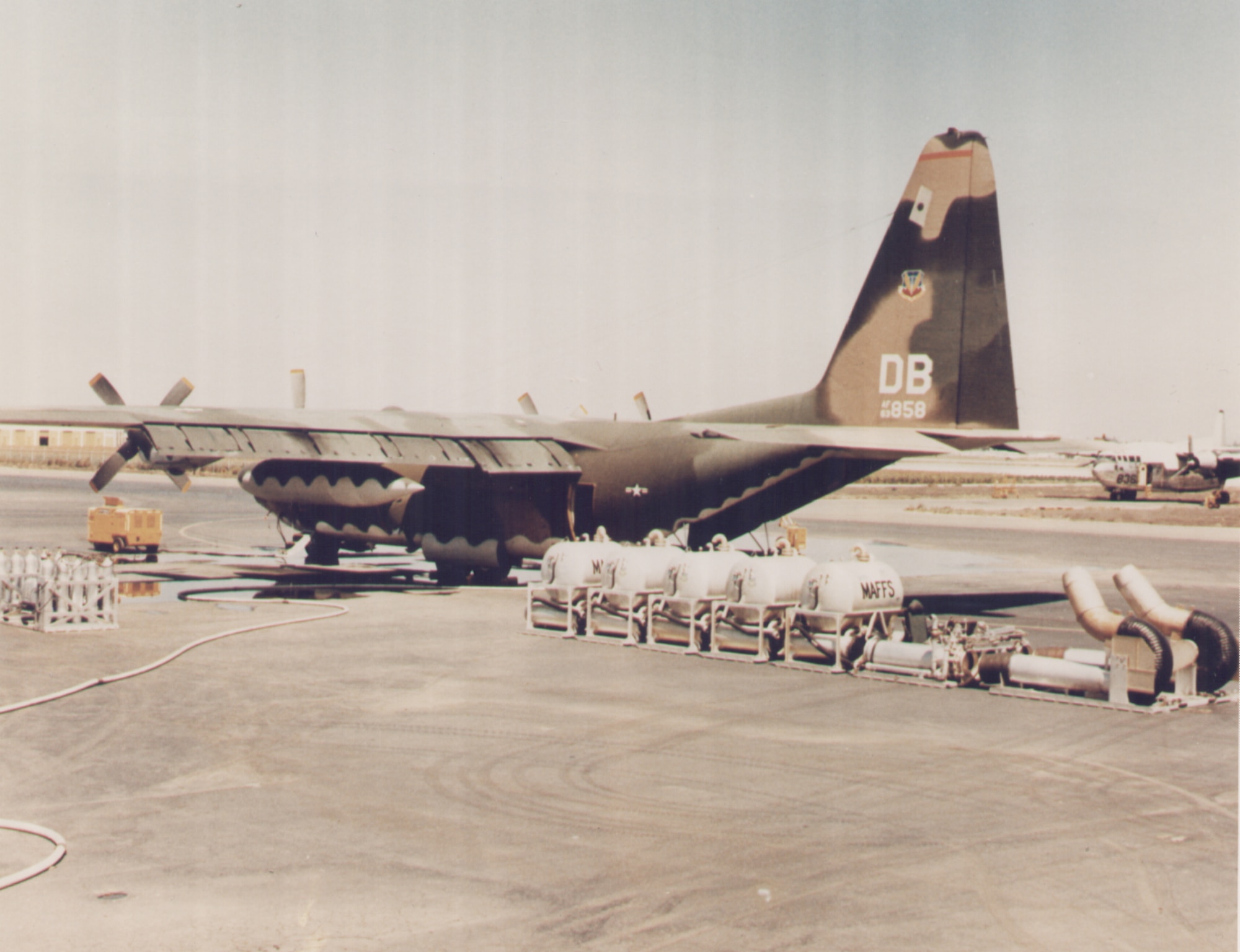 Kirtland Air Force Base, N.M.  -- Five pallet-ready Modular Airborne Fire-fighting System tanks lay near a C-130 before loading.  MAFFS were developed by the Air Force Weapons Laboratory, now the Air Force Research Laboratory, at Kirtland AFB in 197. MAFFS recently staged at Kirtland AFB to help with local wildfires. (courtesy photo)