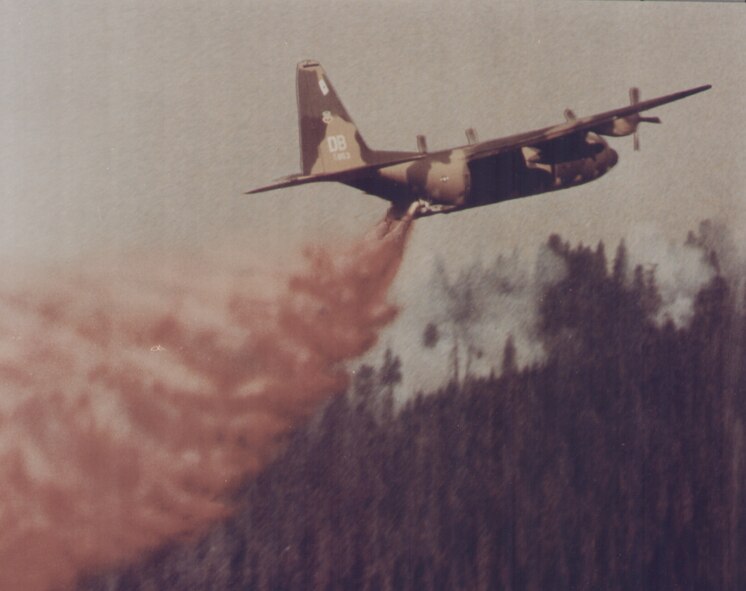 Kirtland Air Force Base, N.M.  -- A C-130 tests a Modular Airborne Fire-fighting System prototype in Arizona.  MAFFS were developed by the Air Force Weapons Laboratory, now the Air Force Research Laboratory, at Kirtland AFB in 197. MAFFS recently staged at Kirtland AFB to help with local wildfires. (courtesy photo)