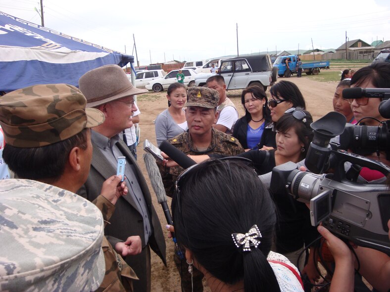 Hentii province regional and local media interviewed Mongolia U.S. Ambassador John Addleton while he visited the medical clinic site at Tsenkermandal village. He also visited the engineering construction site in Tsenkermandal and the outpatient clinic in Ondorkhaan city. This is the first Pacific Angel in Mongolia from July 18-23, 2011. Outreach programs in medical, dental, optometry, veterinary and engineering are being held in Delgerkhaan, Jargaltkhaan, and Tsenkhermandal remote villages and Ondorkhaan city. Pacific Angels cultivate bonds and foster goodwill between the U.S. and Asian-Pacific countries through capacity-building in humanitarian assistance.  In its fourth year, Pacific Angels are planned and executed by at 13th Air Force at Joint Base Pearl Harbor-Hickam, Hawaii. (Air Force photo/Lt. Col. Tracey Saiki)