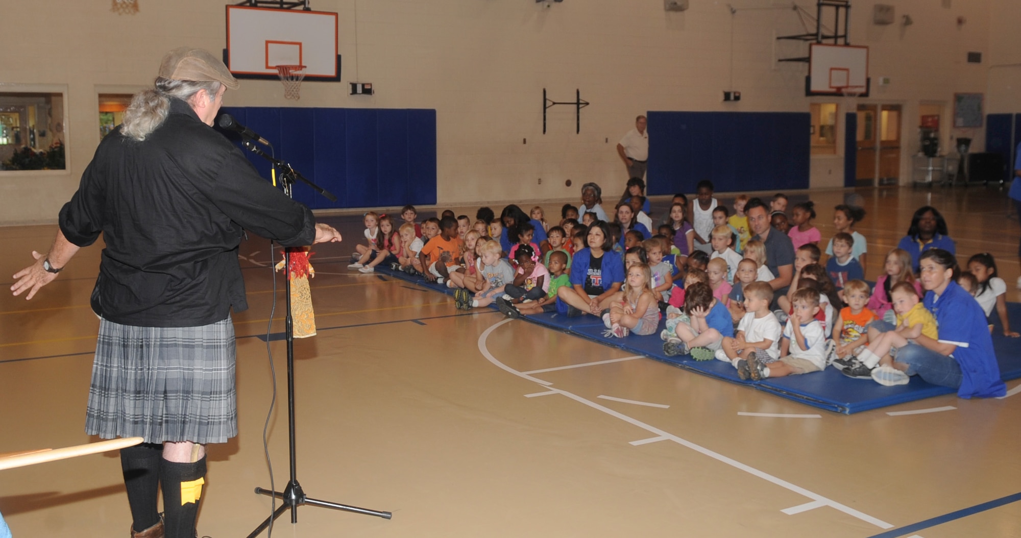 Rickey Pittman, storyteller, author and folksinger, performs for the children at the youth center for the finale of the Summer Reading Program on Barksdale Air Force Base, La., July 19. This year, the Summer Reading Program had 174 participants who read to receive prizes such as bikes and teddy bears. (U.S. Air Force photo/Senior Airman Kristin High)(RELEASED)