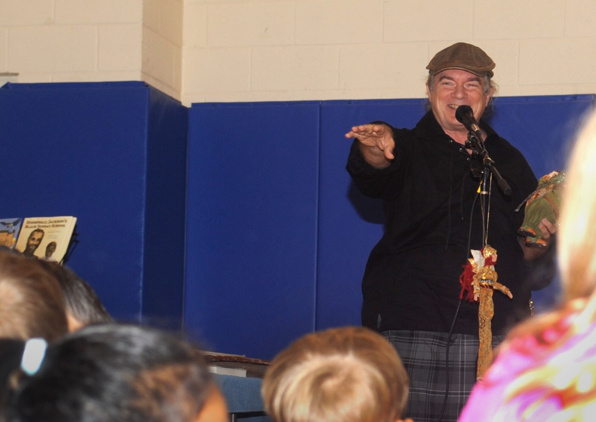 Rickey Pittman, storyteller, author and folksinger, recites stories to children at the youth center for the finale of the Summer Reading Program on Barksdale Air Force Base, La., July 19. Pittman presents his stories, music and programs at schools, libraries, organizations, museums, Civil War Reenactments and Celtic festivals throughout the South. (U.S. Air Force photo/Senior Airman Kristin High)(RELEASED)