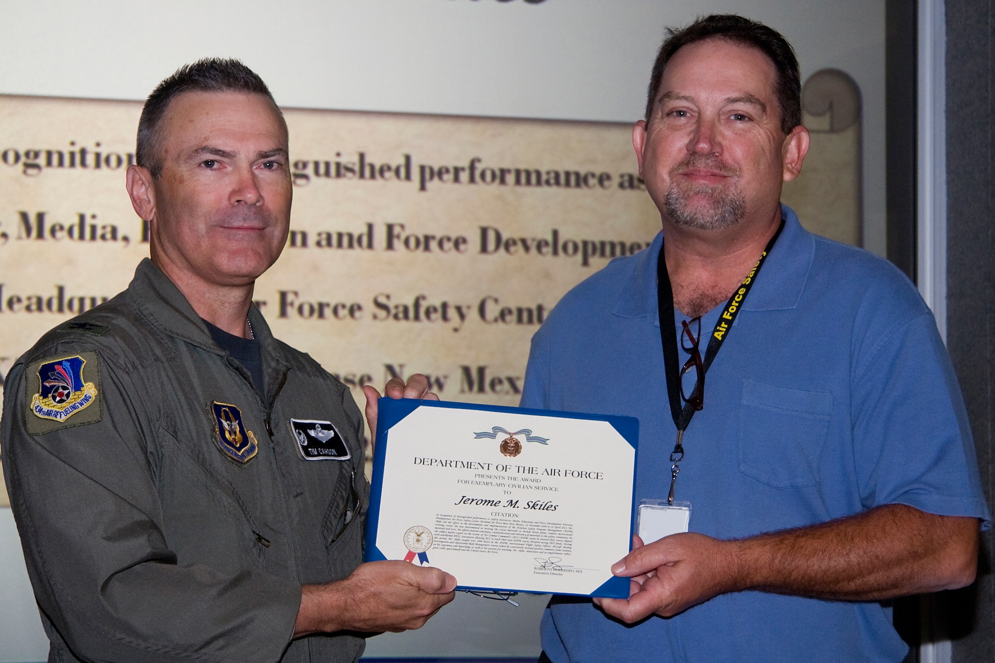 Jerry Skiles, 434th Air Refueling Wing safety office, receives an exemplary civilian service award from Col. William T. "Tim" Cahoon, 434th ARW commander during a recent civilian commander's call. According to the award's narrative, it was given in recognition of Skiles distinguished performance as a safety instructor with the Media, Education and Force Development Division or the Air Force Safety Center at Kirtland Air Force Base, N.M., from Nov. 24, 2008 to April 22, 2011. (U.S. Air Force photo/Tech. Sgt. Mark R. W. Orders-Woempner)
