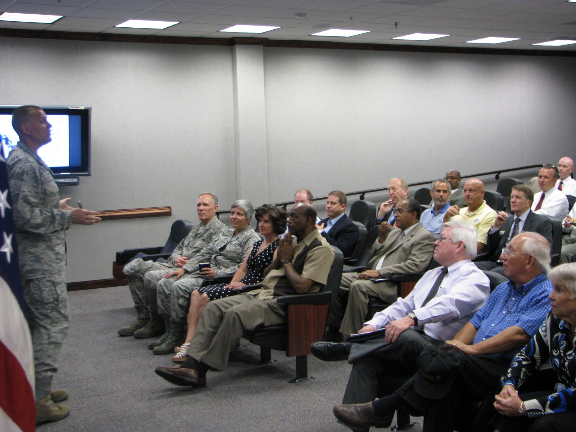 Col. Paul Nelson, 480th Intelligence, Surveillance and Reconnaissance Wing commander, provides a comprehensive overview to over 30 civic leaders and community partners to increase their awareness of the wing’s mission as part of the community relations program at Langley Air Force Base, Va. on July 22. (U.S. Air Force Photo/Maj. Eric Hilliard)