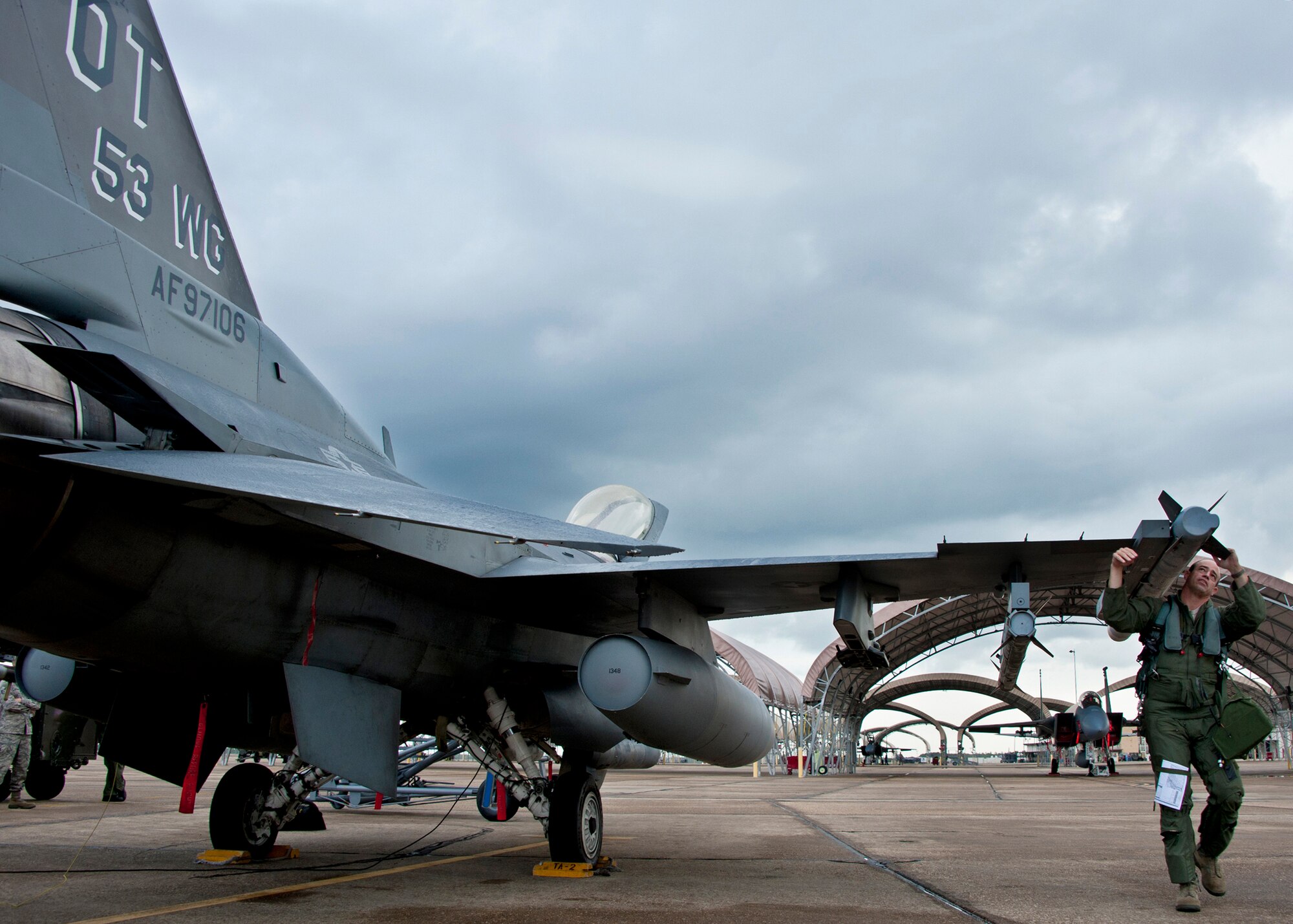 Col. Michael Gantt, the 53rd Wing commander, performs checks on the wing’s flagship F-16 Fighting Falcon for the final time as commander prior to a flight July 22 at Eglin Air Force Base, Fla.  Gantt leaves the wing for a position with Air Force A5 at the Pentagon.  (U.S. Air Force photo/Samuel King Jr.)