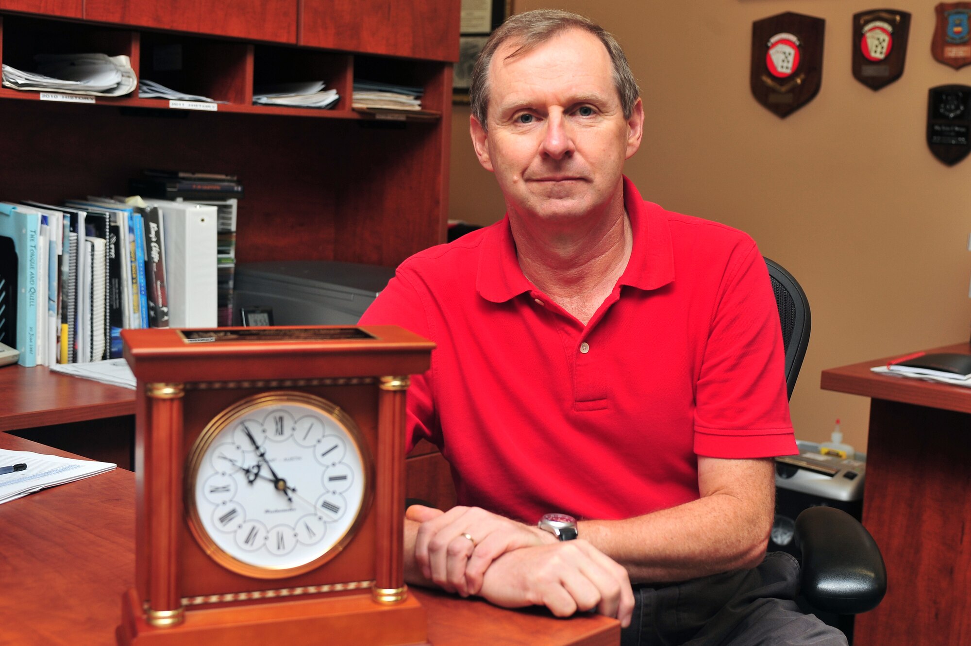 Art Sevigny, 20th FW historian, sits beside his Air Combat Command Excellence in History Programs Allen S. Major Award, Shaw Air Force Base, S.C., July 20, 2011. Sevigny was recognized by the ACC Commander Gen. William Fraser, as having a level of detail and analysis normally found after years of experience. He also completed his first-ever deployment as a historian to Balad Air Base, Iraq, where he revitalized a history program that suffered from eight months of neglect. Sevigny will now compete at the Air Force level. (U.S. Air Force photo/Airman 1st Class Ashley Gardner) (Released)
