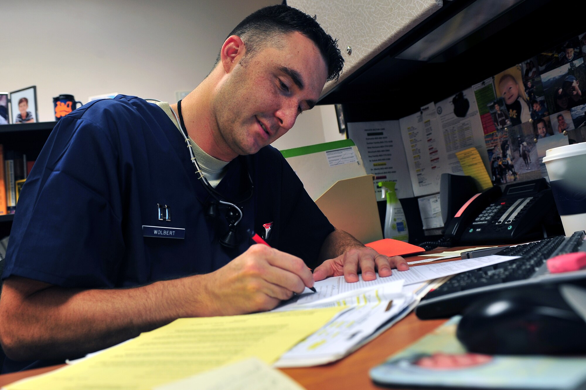 U.S. Air Force Capt. Christopher Wolbert, 20th Dental Squadron dentist, fills out paperwork after performing a routine procedure on a patient July 20, 2011, Shaw Air Force Base, S. C. Shaw’s Dental Clinic is vital to mission readiness as all Airmen are required to have any dental issues taken care of prior to deployment. (U.S. Air Force photo by Airman 1st Class Ashley Gardner)(Released)