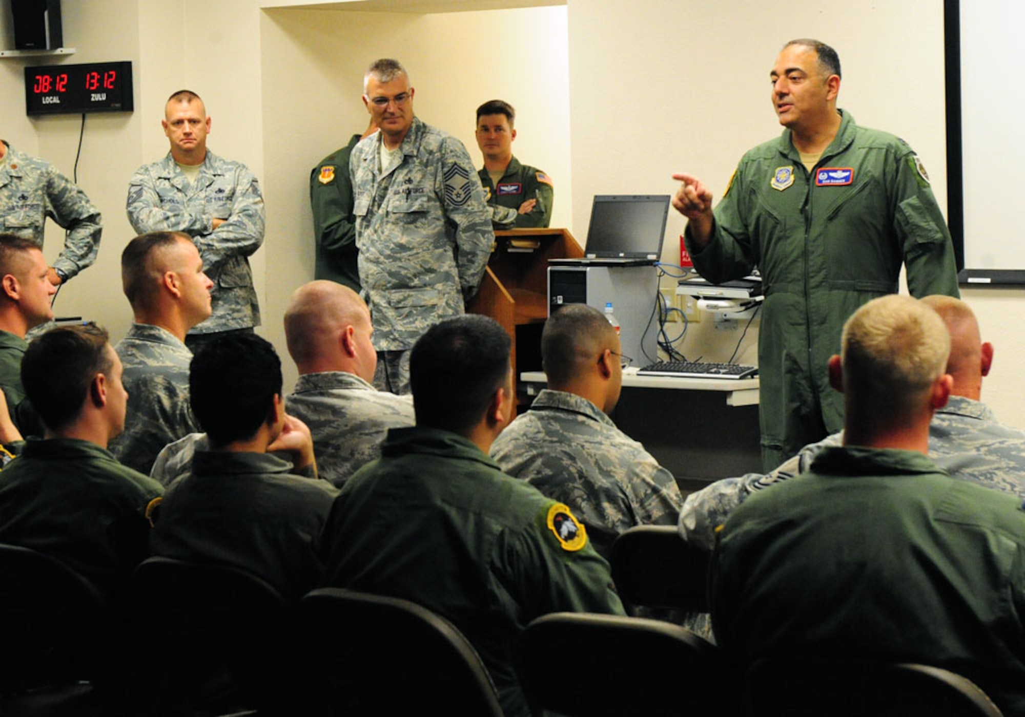 DYESS AIR FORCE BASE, Texas -- Col. Dan Dagher, 317th Airlift Group commander, speaks to Airmen before they depart from Dyess for the Air Mobility Command Rodeo at Joint Base Lewis-McChord, Wash., July 22. The AMC Rodeo is a biennial competition within the command. The international competition focuses on improving worldwide air mobility forces' professional core abilities. Competing in the rodeo are Airmen from the 317th Airlift Group, the 7th Security Forces Squadron and the 7th Logistics Readiness Squadron. (U.S. Air Force photo by Senior Airman Chelsea Browning/Released)