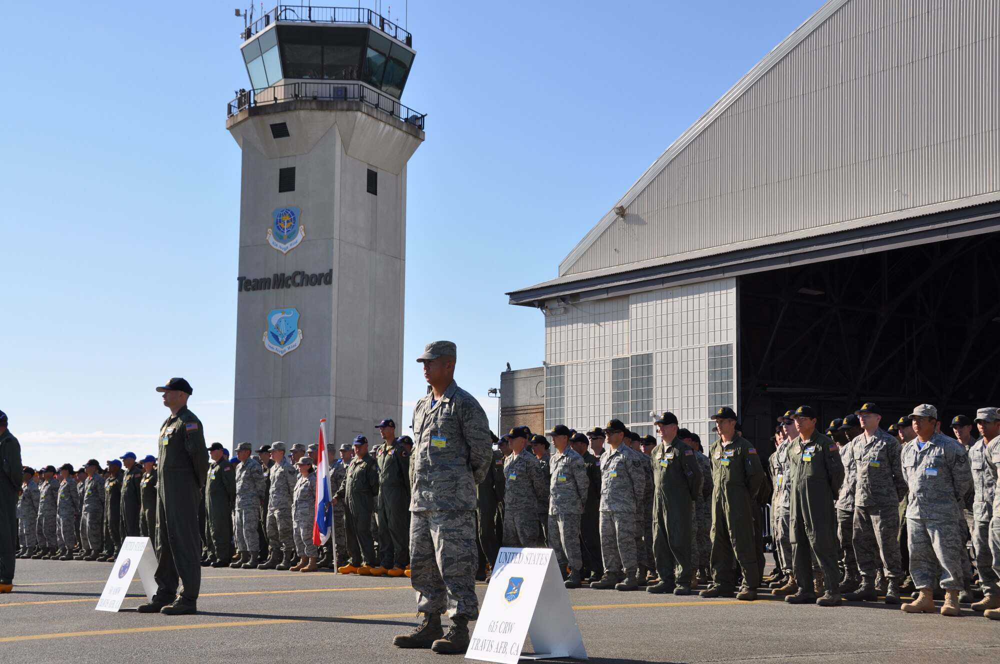 Maj. Nathan Koran, 60th Air Mobility Wing rodeo team lead and 1st Lt. Chris Smith, 615th Contingency Response Wing, rodeo team lead, prepare their formations before the opening ceremonies for the Air Mobility Rodeo 2011 July 24, 2011 at Joint Base Lewis-McChord, Wash. (U.S. Air Force photo/ Airman 1st Class Michael Battles)