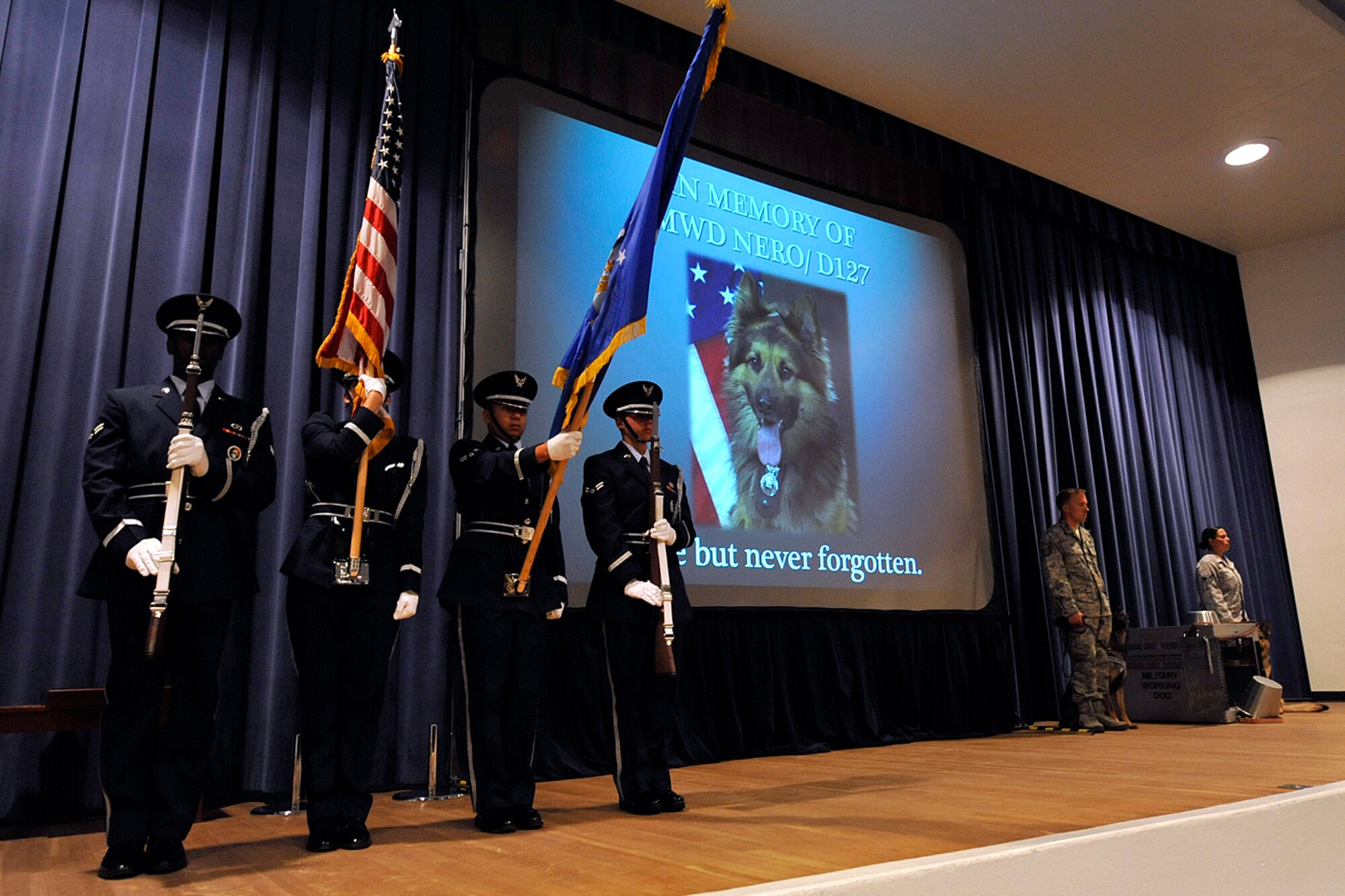 The Peterson Air Force Base High Frontier Honor Guard presents the colors prior to a memorial on July 21, 2011, for Nero, a 21st Security Forces Squadron military working dog who passed away earlier this year. Military working dogs are considered not just animals, but essential partners to their human comrades. The loss of a working dog is similar to the loss of any other member of the unit. (U.S. Air Force photo/Rob Bussard)
