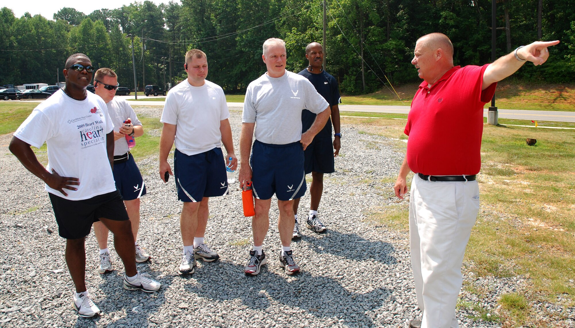 Fred Engel, 94th Services  Squadron Recreation and Fitness Manager, gives trail directions for Summer Fun Run participants, Gunnery Sgt. John Goode, Master Sgt. Steve Denton, Tech. Sgt. Steve Griggs, Senior Master Sgt. John Murray and Master Sgt. Richard Bethune, at Dobbins Air Reserve Base,  Ga., July 20.  (U.S. Air Force photo/ Brad Fallin)
