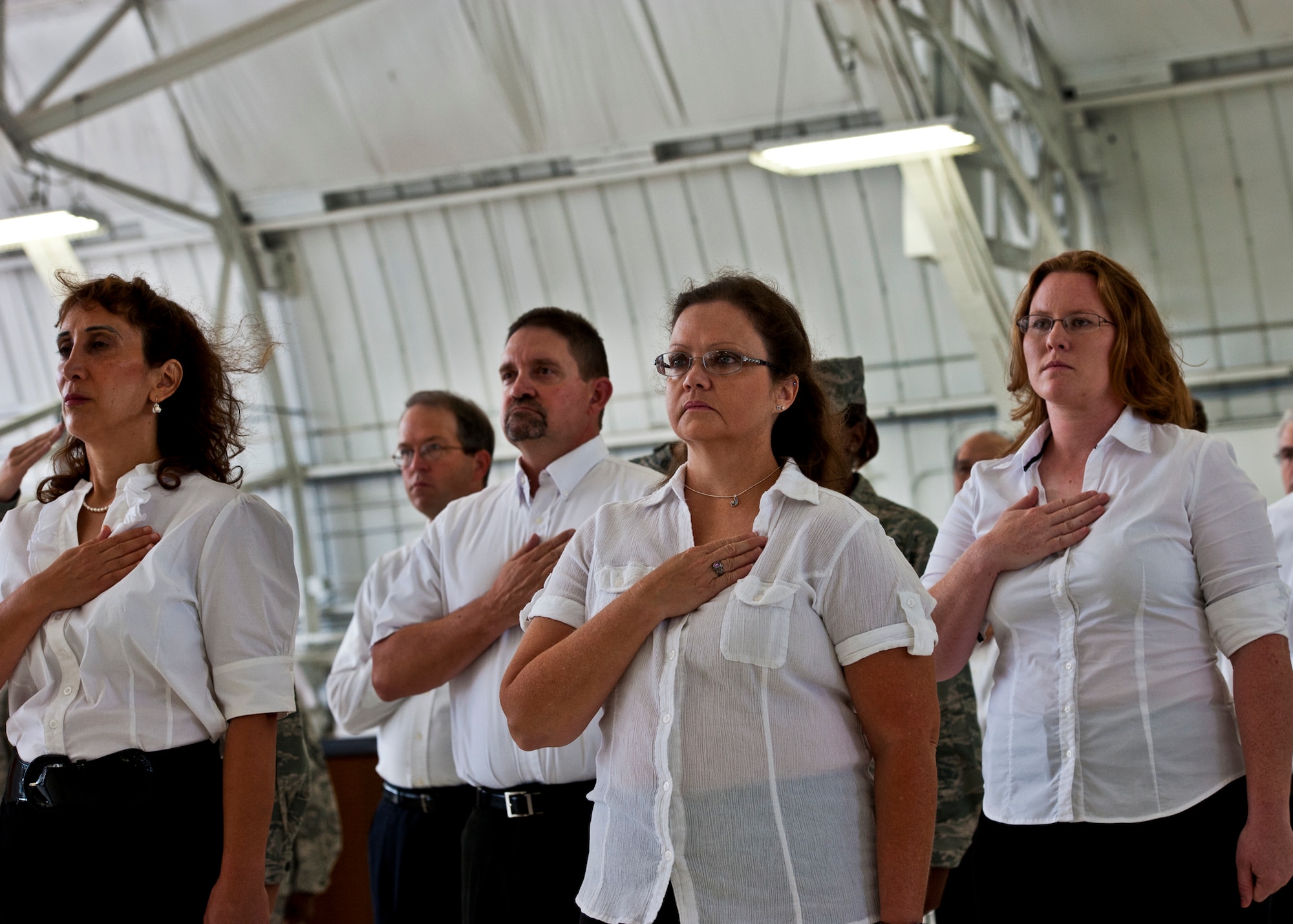 Civilians and Airmen stand together in the 46th Test Wing’s formation during the change of command ceremony July 22 at Eglin Air Force Base, Fla.  Col. Colin Miller took command of the wing from Col. Michael Brewer. (U.S. Air Force photo/Samuel King Jr.)