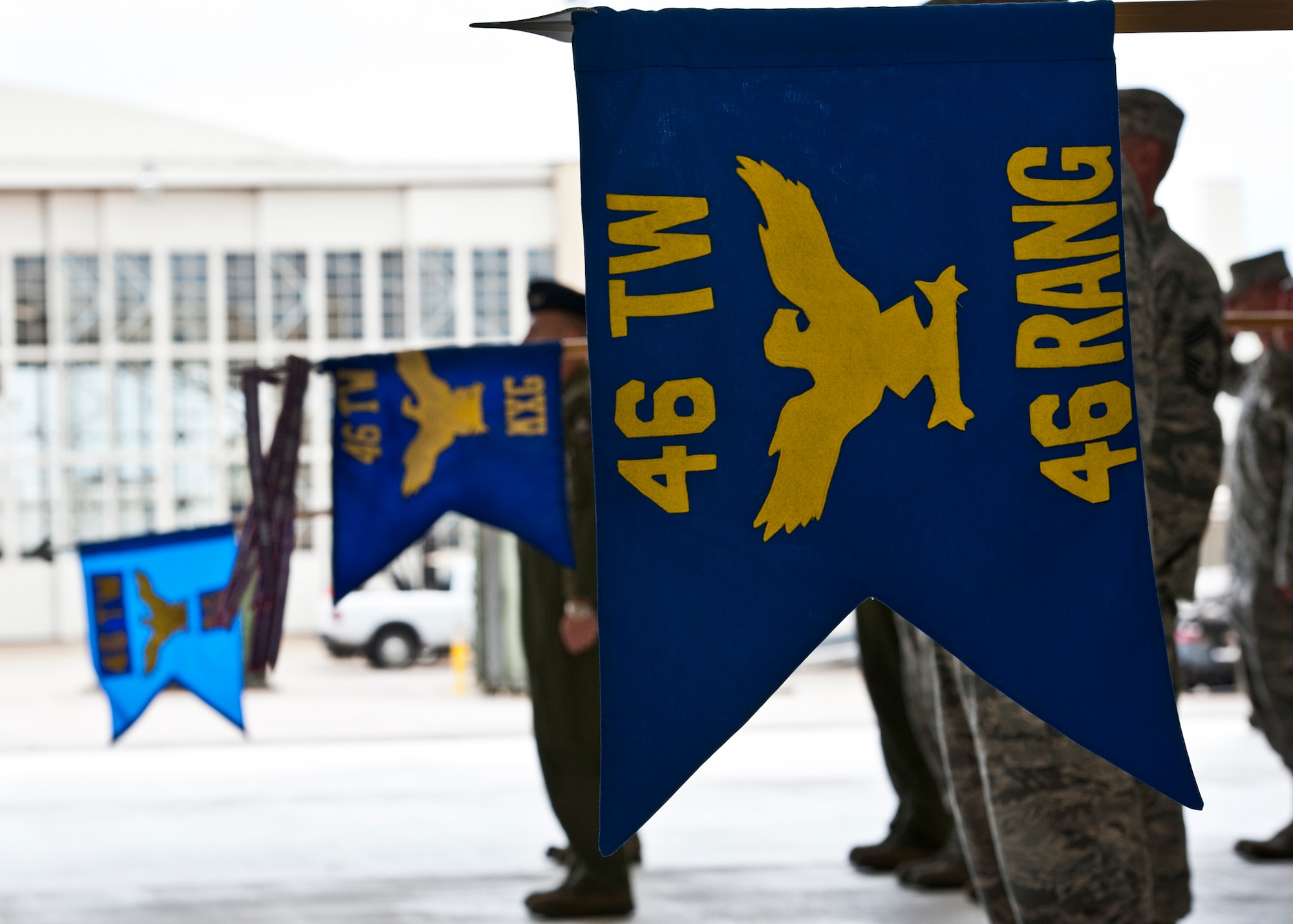 Group banners are displayed during a presentation of arms as part of the 46th Test Wing change of command ceremony July 22 at Eglin Air Force Base, Fla. Col. Colin Miller took command of the wing from Col. Michael Brewer.  (U.S. Air Force photo/Samuel King Jr.)