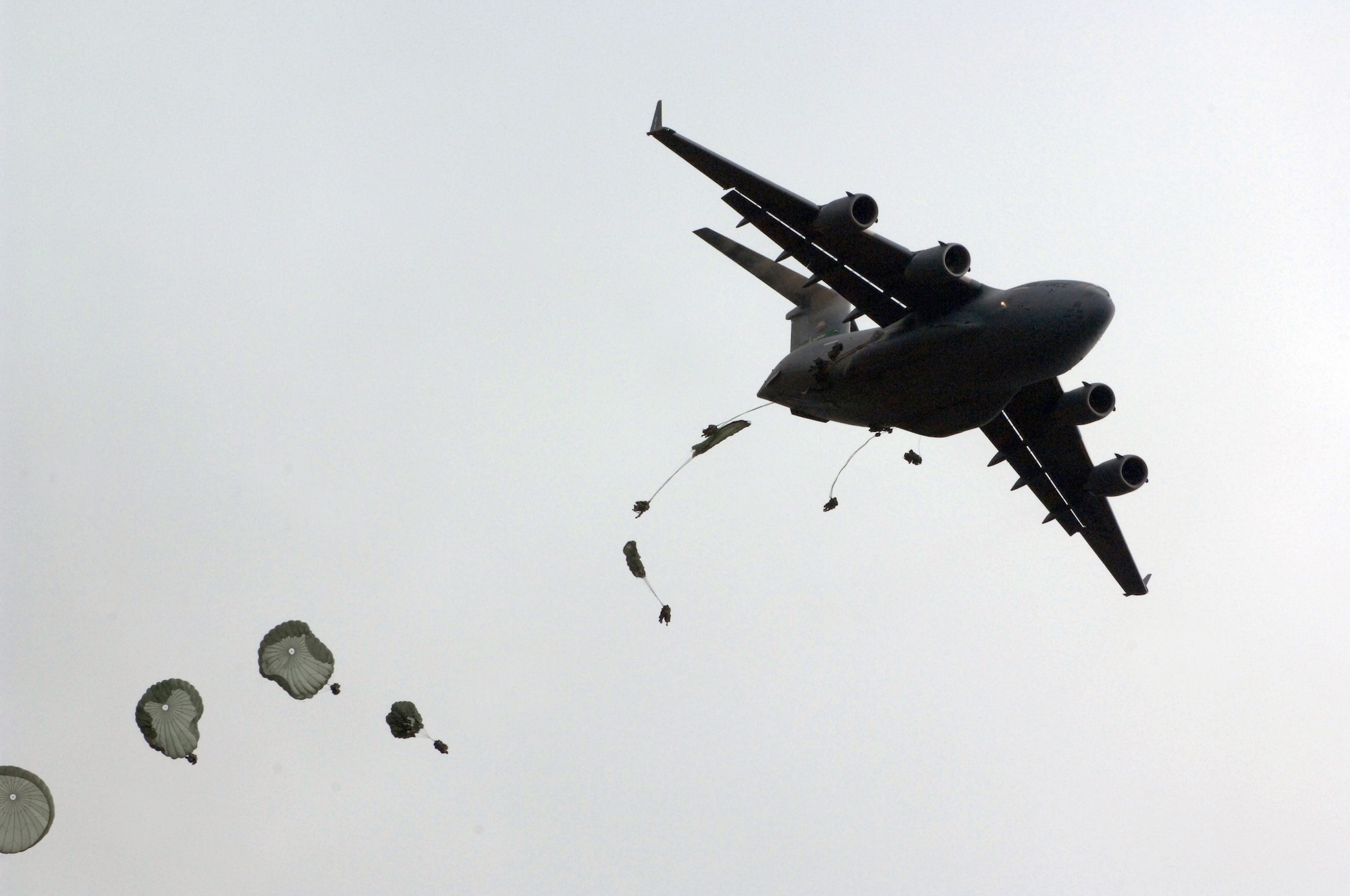 U.S. soldiers of 1st Battalion, 501st Parachute Infantry Regiment, Fort Richardson, Alaska, parachute out of a U.S. Air Force C-17 Globemaster III aircraft into the Shoalwater Bay Training Area during Exercise Talisman Sabre 2011 July 17, 2011. Talisman Sabre 2011 is an AMC-supported exercise designed to train U.S. and Australian forces to plan and conduct Combined Task Force operations to improve combat readiness and interoperability on a variety of missions from conventional conflict to peacekeeping and humanitarian assistance efforts. 