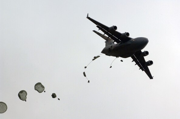 U.S. soldiers of 1st Battalion, 501st Parachute Infantry Regiment, Fort Richardson, Alaska, parachute out of a U.S. Air Force C-17 Globemaster III aircraft into the Shoalwater Bay Training Area during Exercise Talisman Sabre 2011 July 17, 2011. Talisman Sabre 2011 is an AMC-supported exercise designed to train U.S. and Australian forces to plan and conduct Combined Task Force operations to improve combat readiness and interoperability on a variety of missions from conventional conflict to peacekeeping and humanitarian assistance efforts. (U.S. Air Force photo) 


