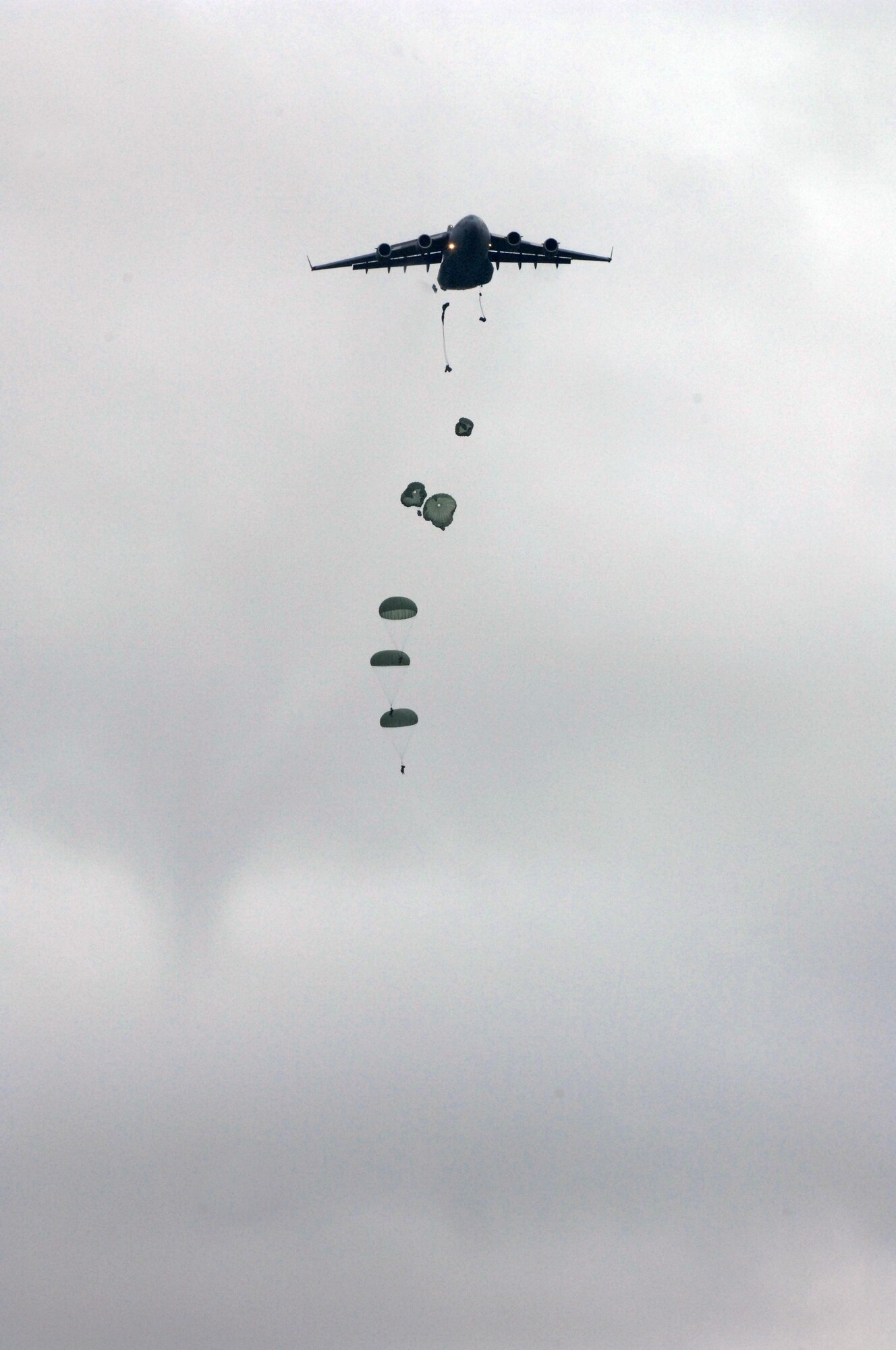U.S. soldiers of 1st Battalion, 501st Parachute Infantry Regiment, Fort Richardson, Alaska, parachute out of a U.S. Air Force C-17 Globemaster III aircraft into the Shoalwater Bay Training Area during Exercise Talisman Sabre 2011 July 17, 2011. Talisman Sabre 2011 is an AMC-supported exercise designed to train U.S. and Australian forces to plan and conduct Combined Task Force operations to improve combat readiness and interoperability on a variety of missions from conventional conflict to peacekeeping and humanitarian assistance efforts. 